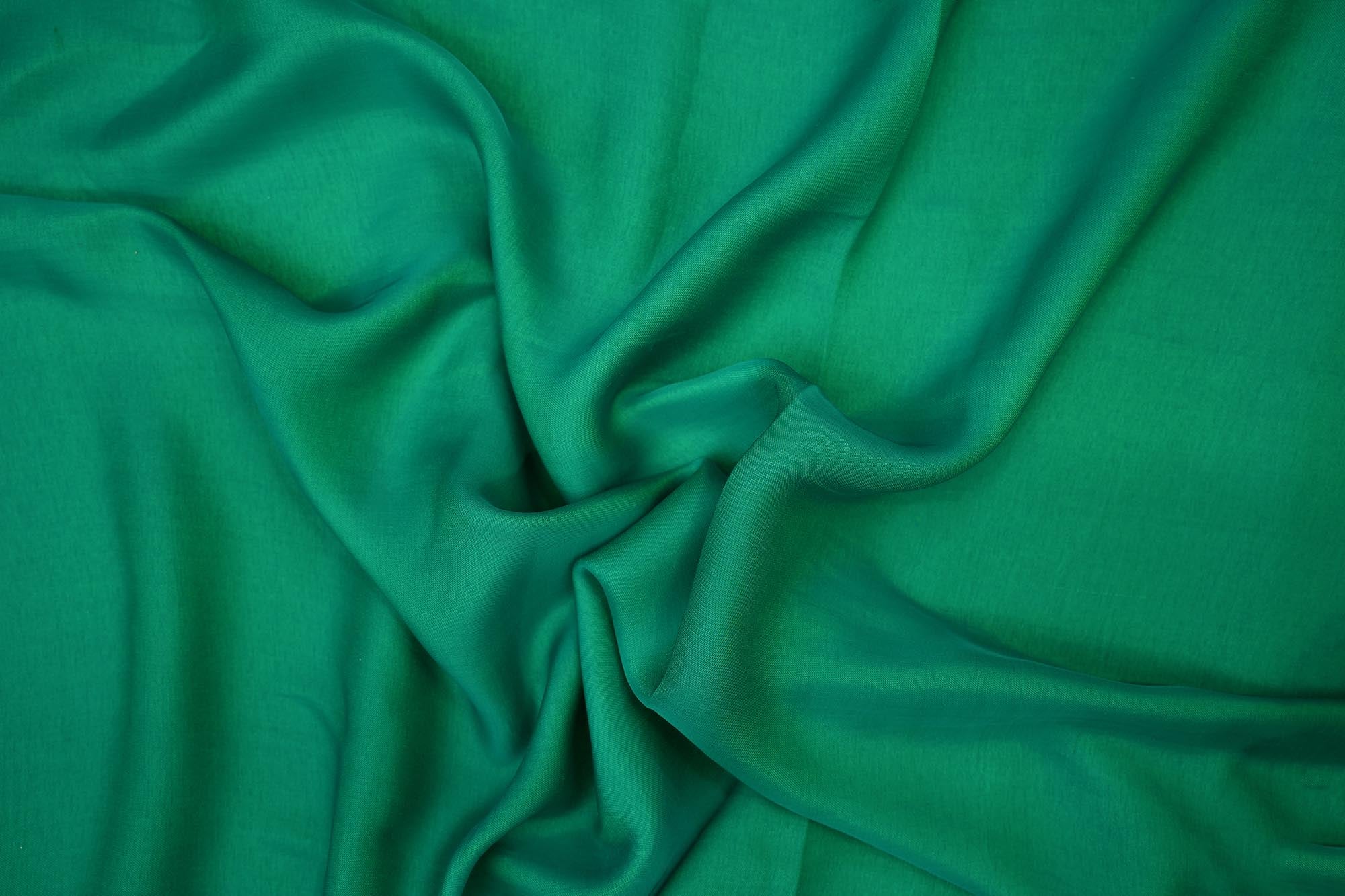 Sea green coloured barfi silk fabric