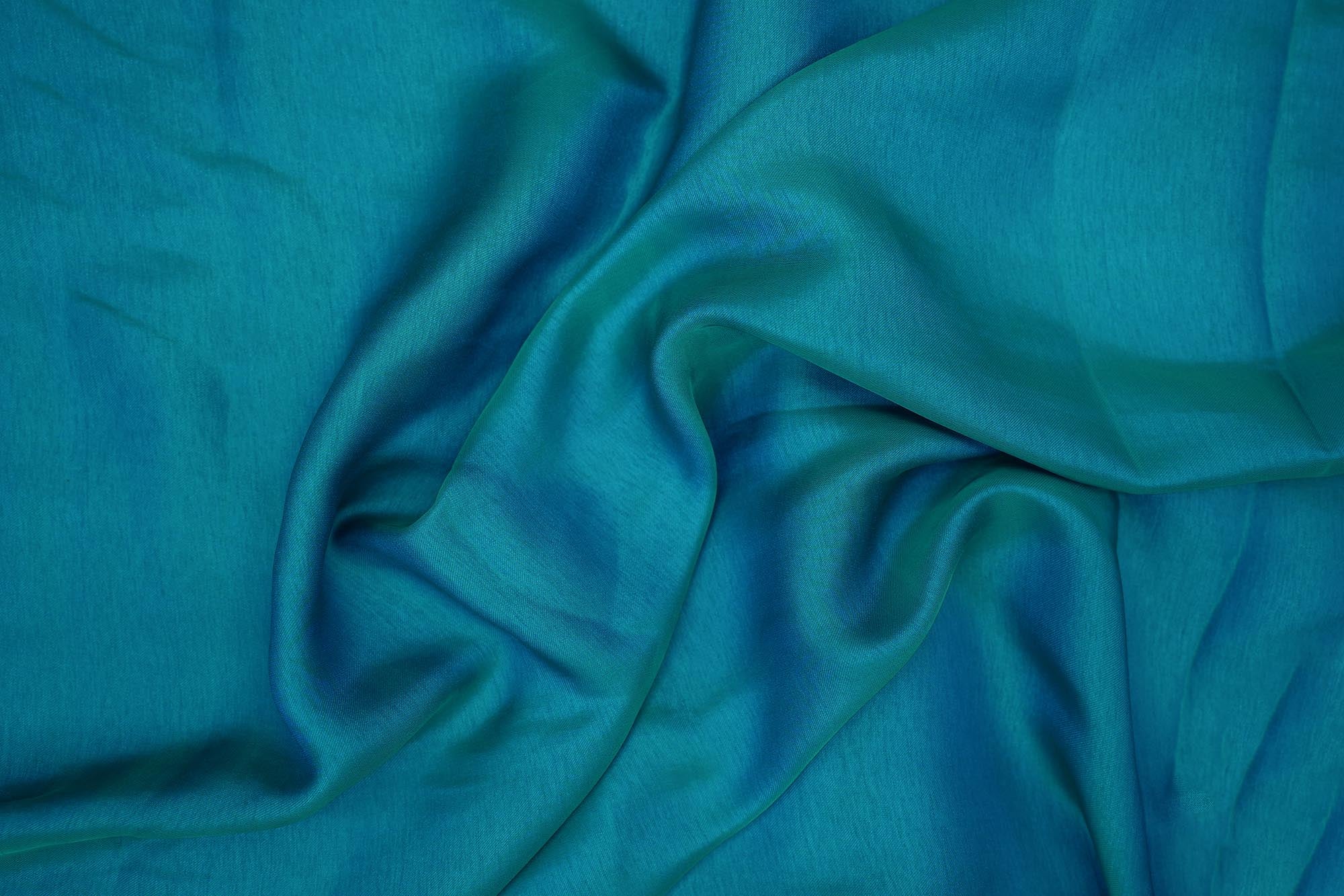 Turquoise coloured barfi silk fabric