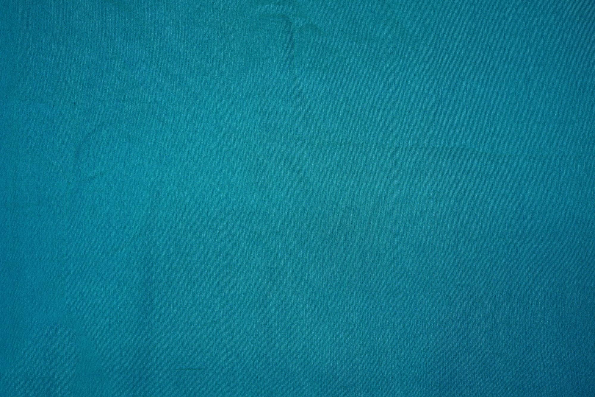 Turquoise coloured barfi silk fabric