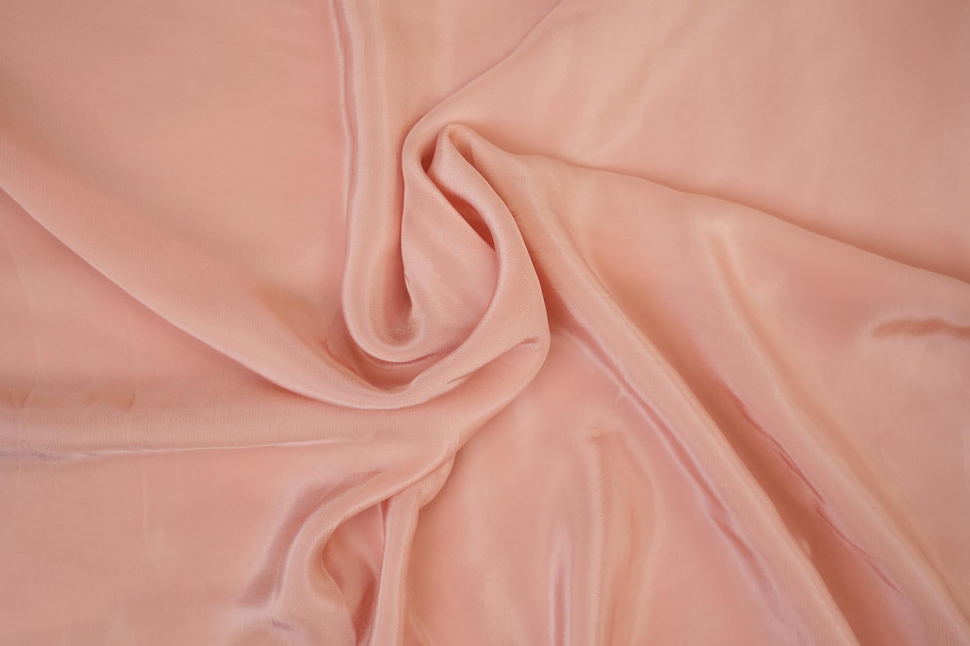 Dusky pink coloured crepe fabric