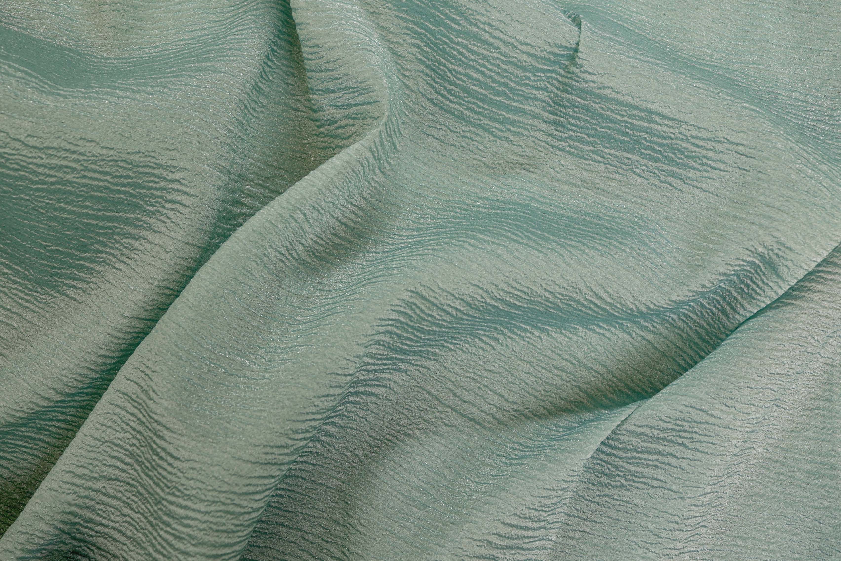 Greenish blue coloured crushed tissue organza fabric