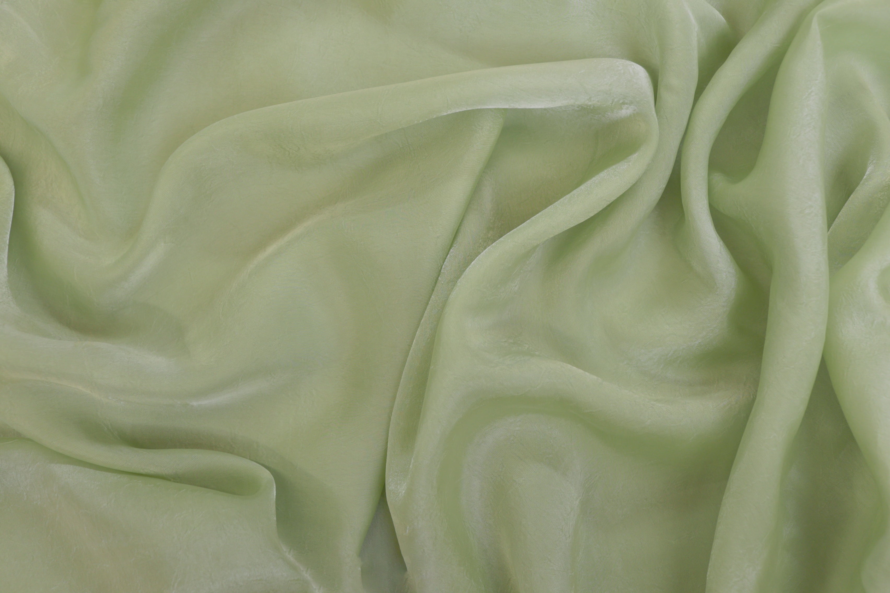 Pista green coloured silk crushed texture fabric