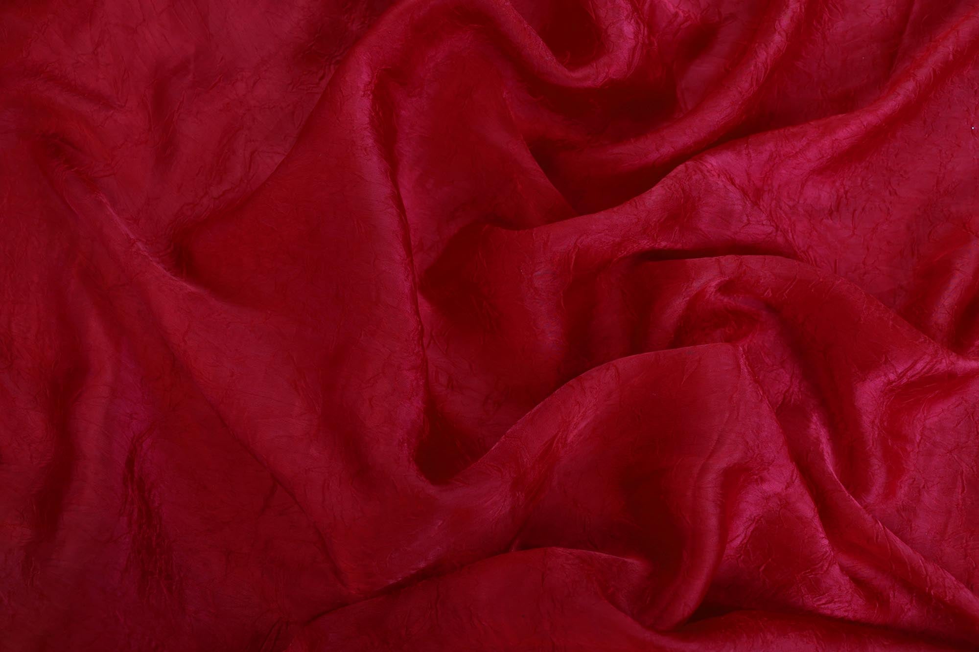 Rani pink coloured silk crushed texture fabric