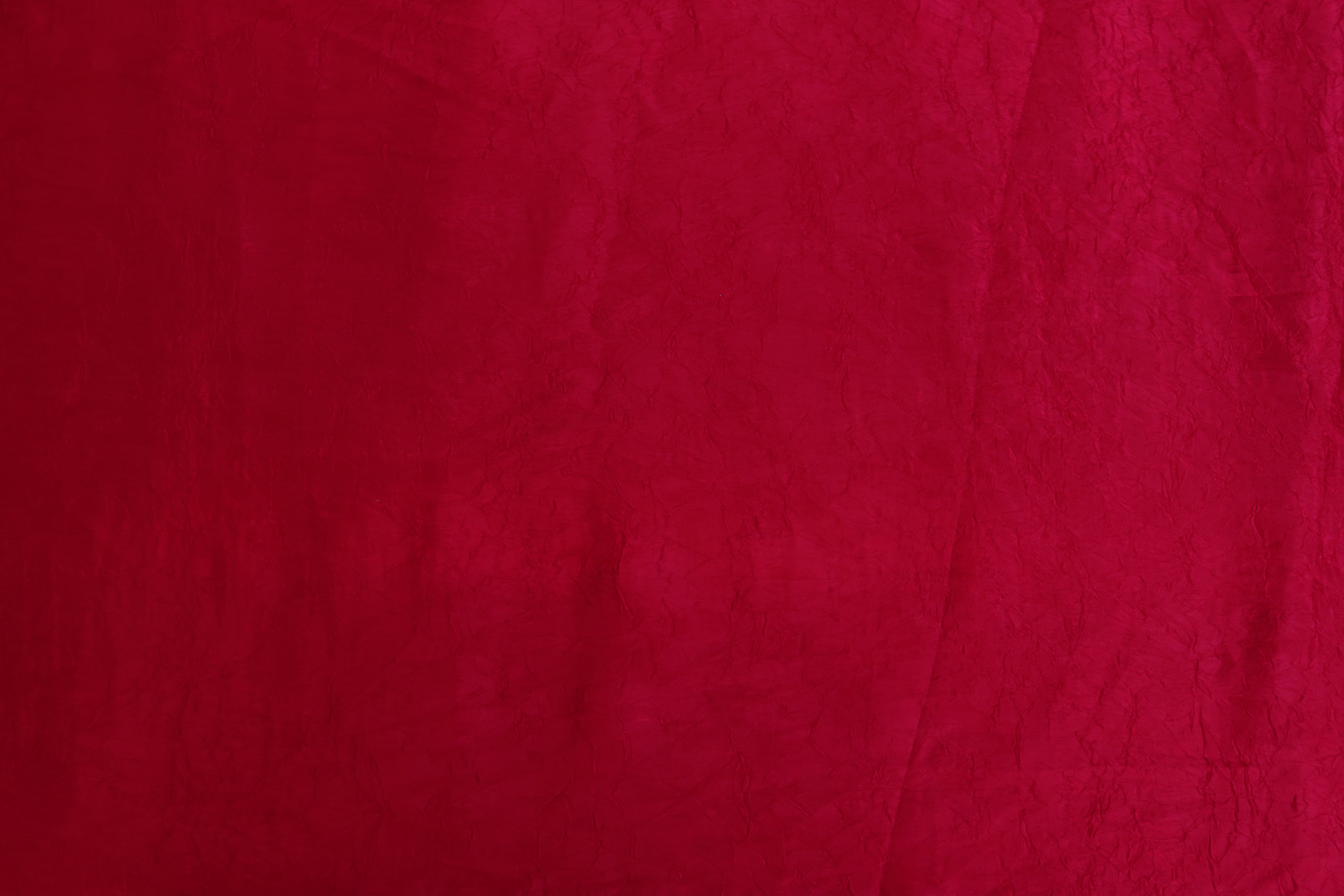 Rani pink coloured silk crushed texture fabric