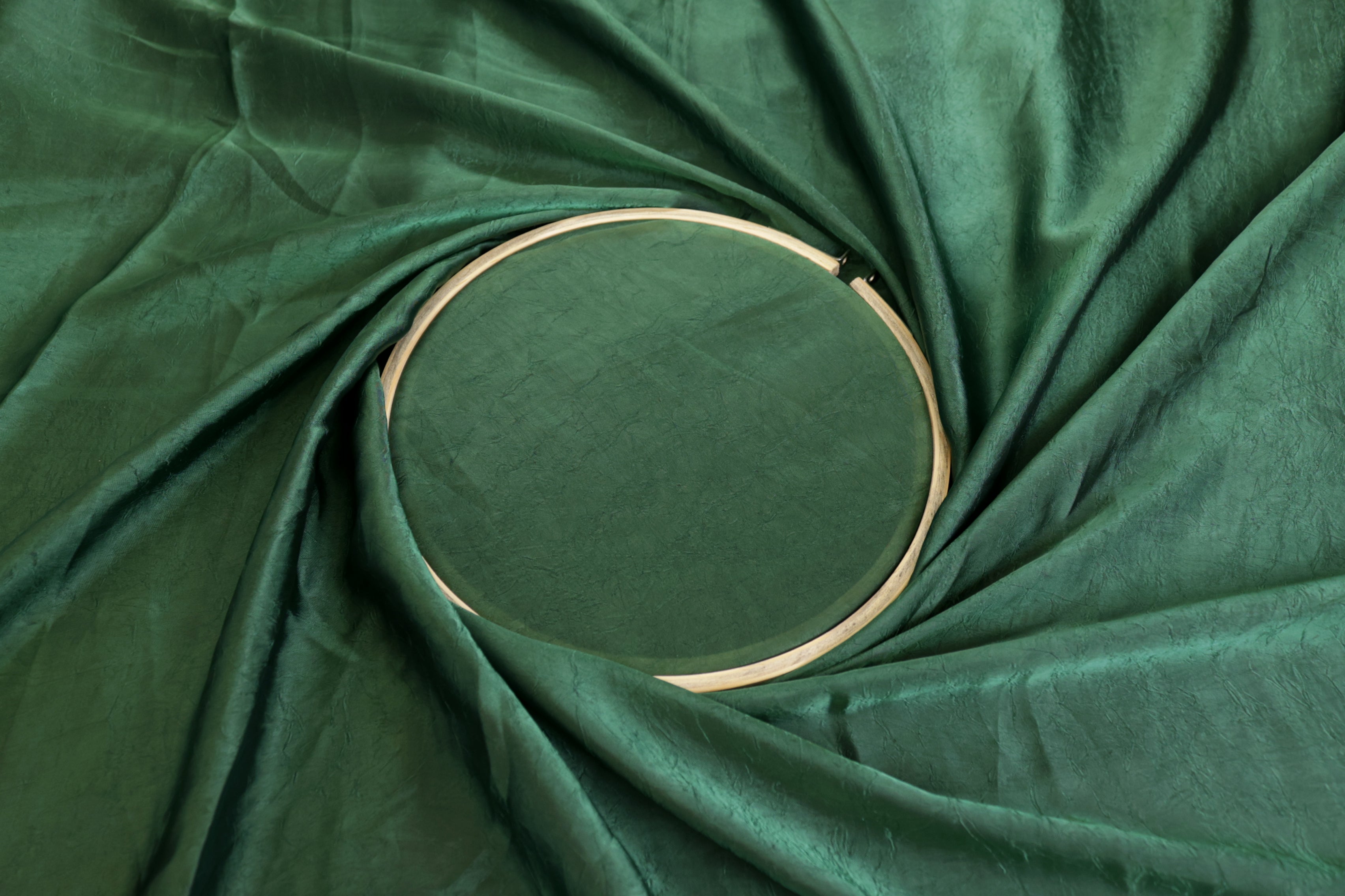 Dark green coloured silk crushed texture fabric