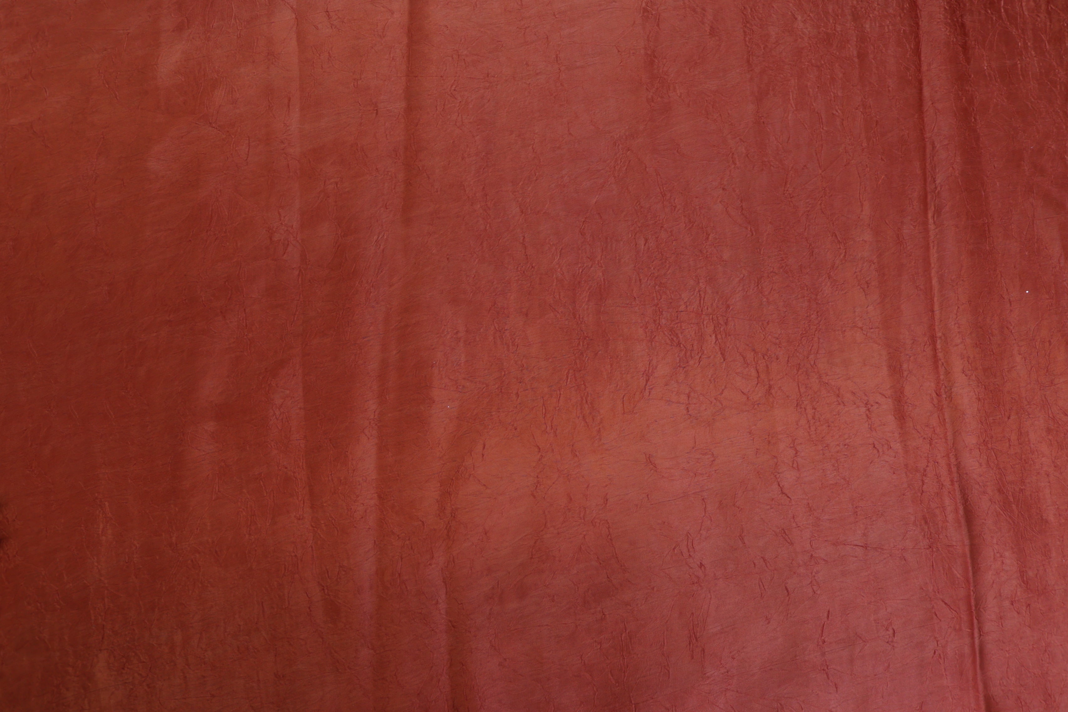 Rust coloured silk crushed texture fabric