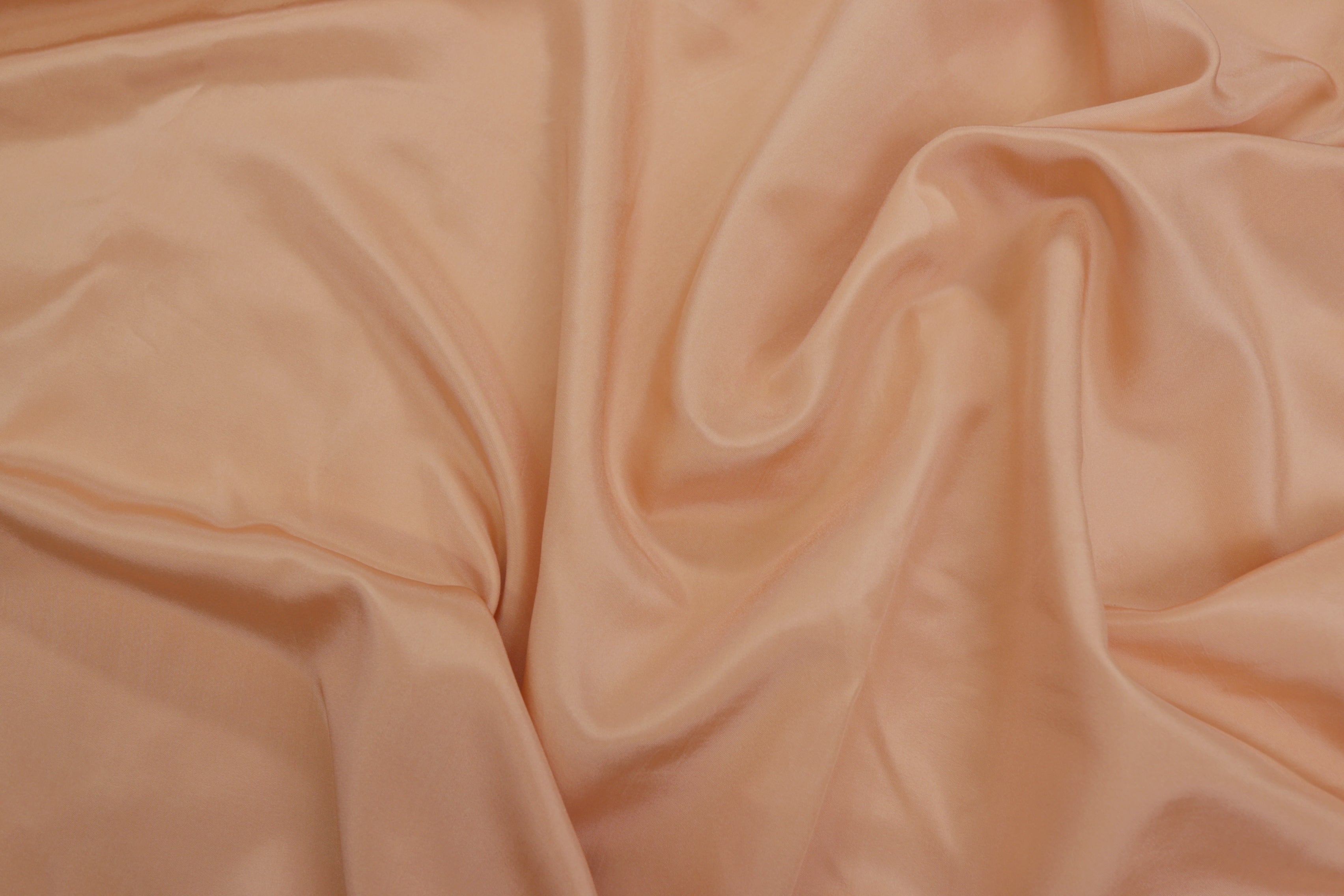 Pastel orange coloured  habutai silk fabric