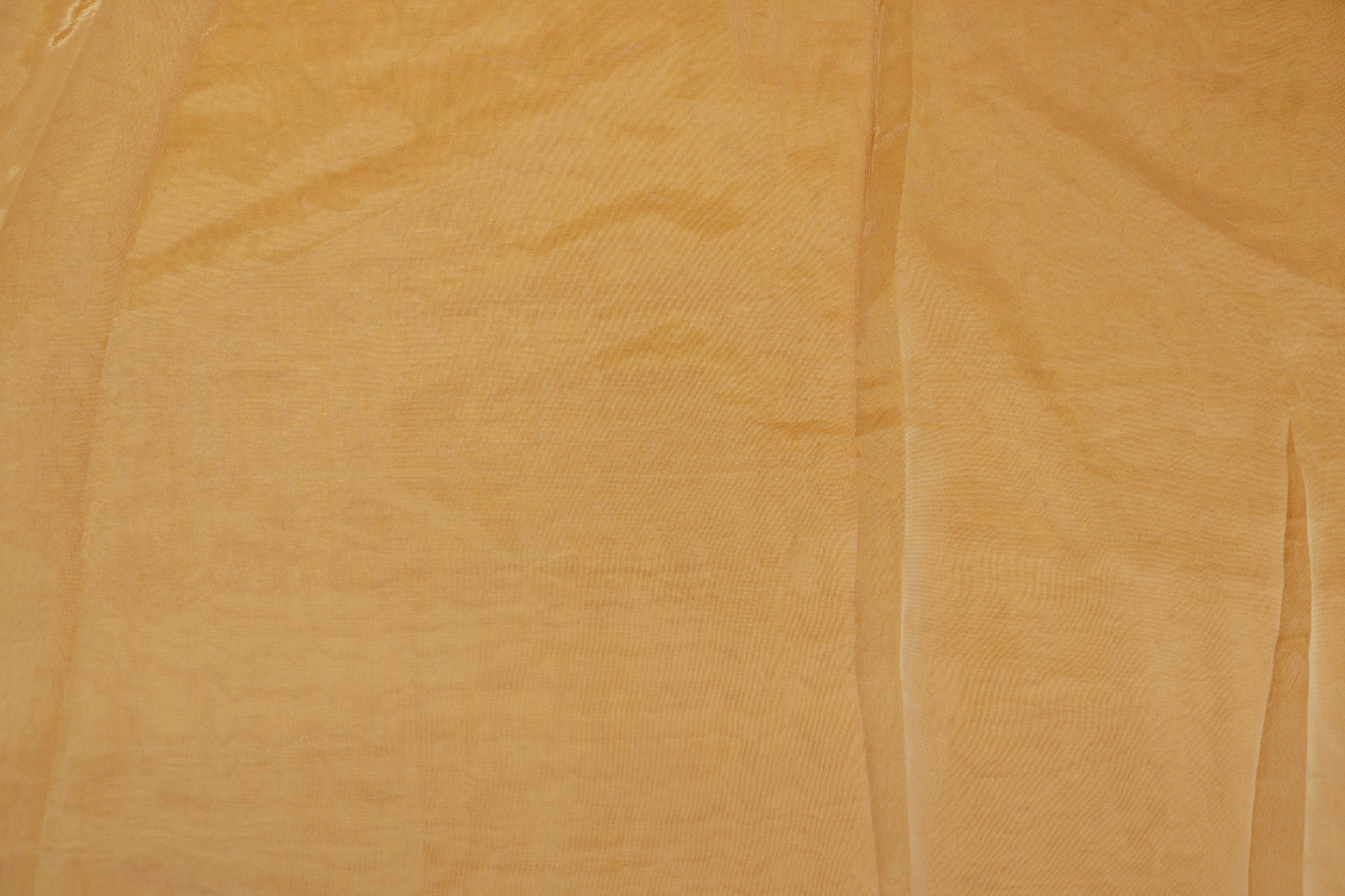 Mustard light coloured Soft tissue tissue fabric with gold shimmer