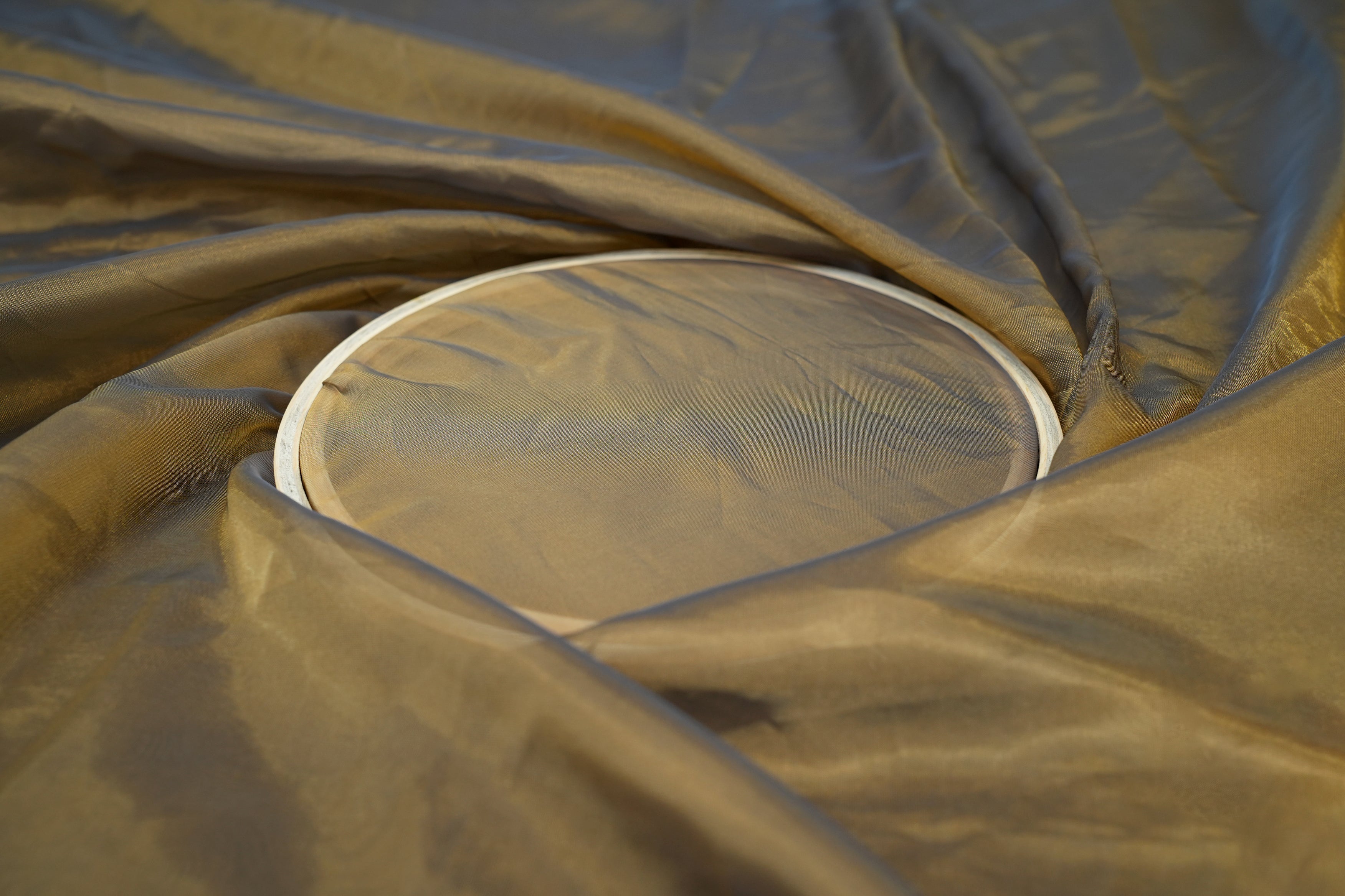 Brown coloured Soft tissue tissue fabric with gold shimmer