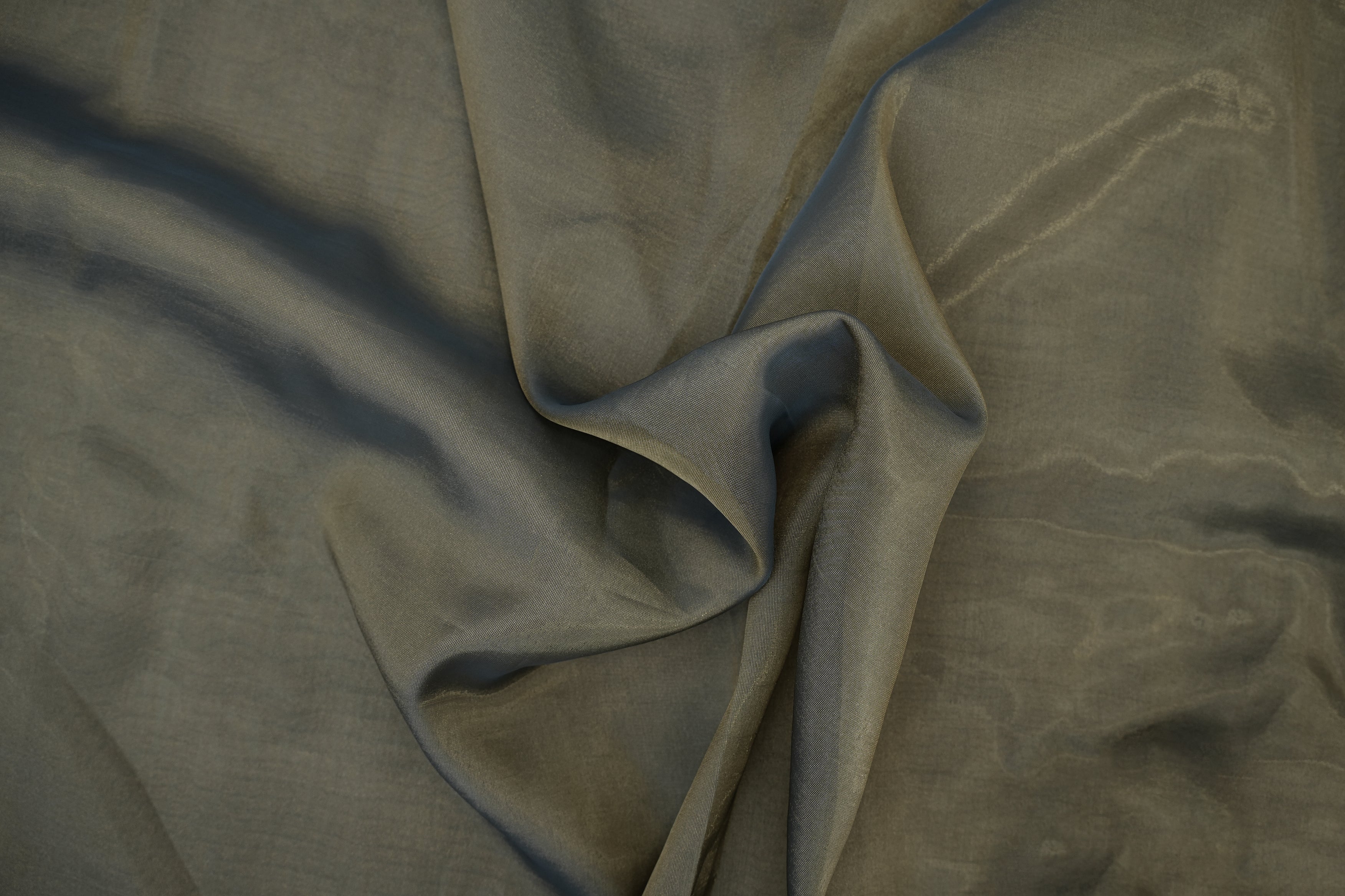 Grey gold coloured Soft tissue tissue fabric with shimmer