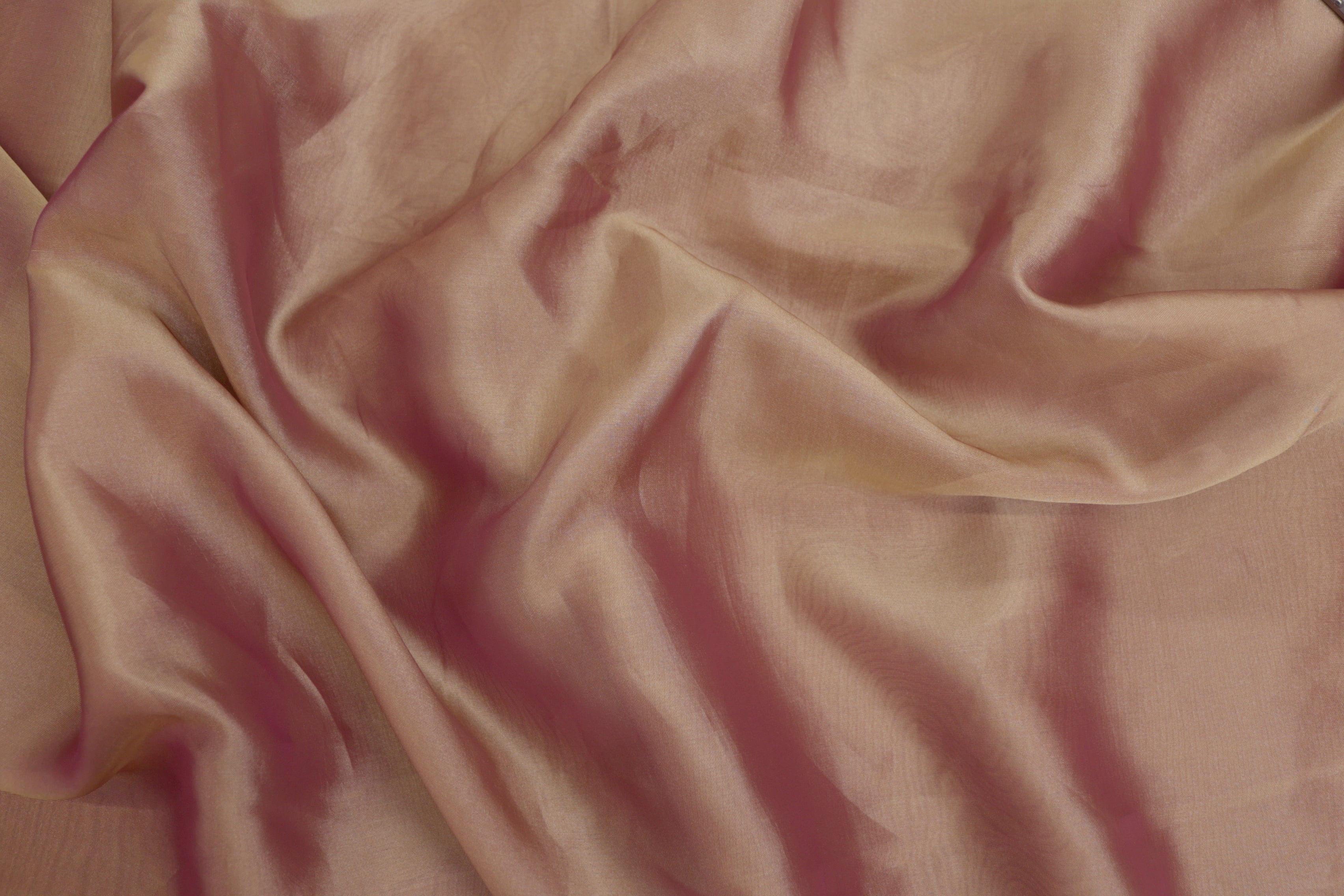 Pink coloured Soft tissue tissue fabric with gold shimmer