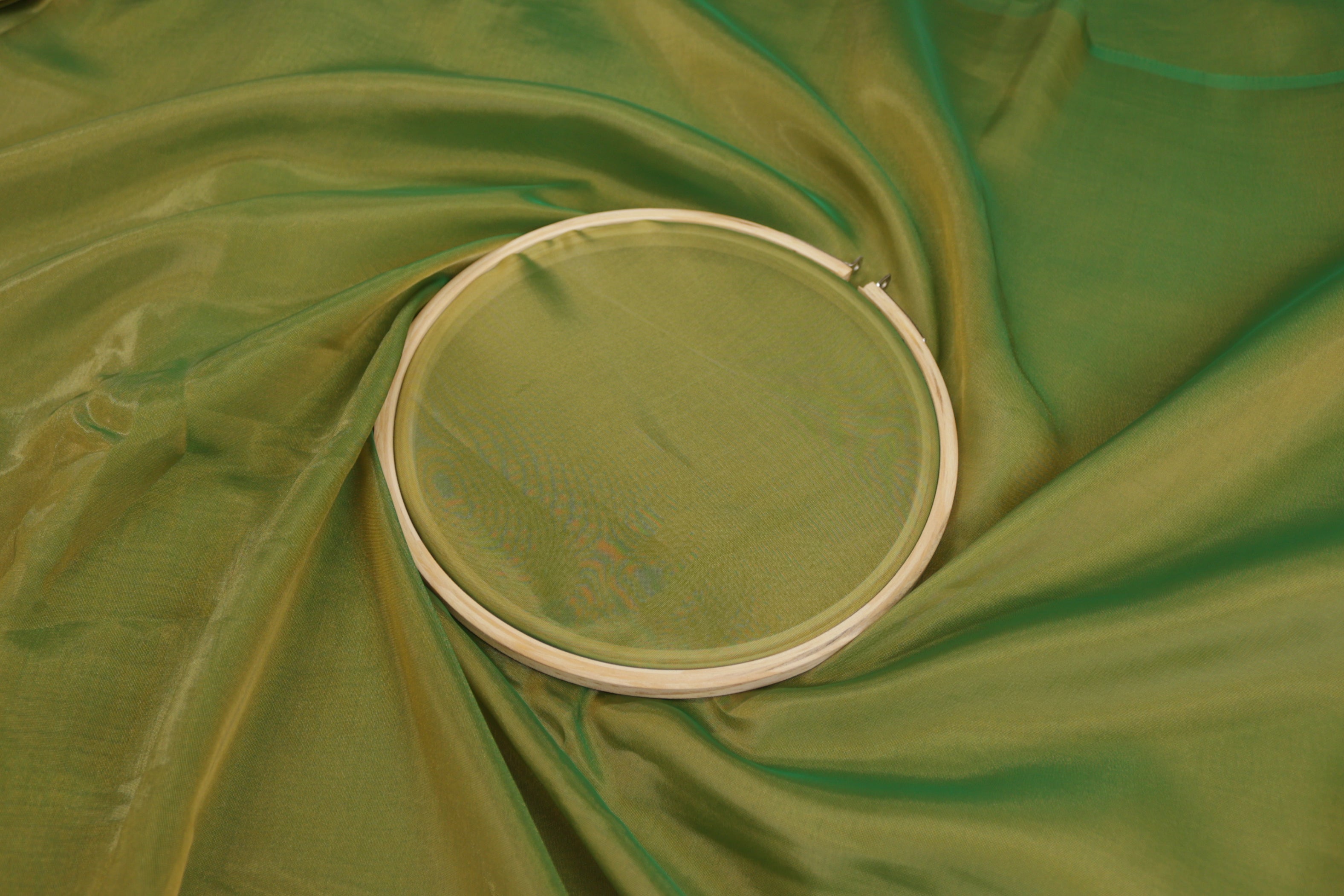 Pakistani green coloured Soft tissue tissue fabric with gold shimmer