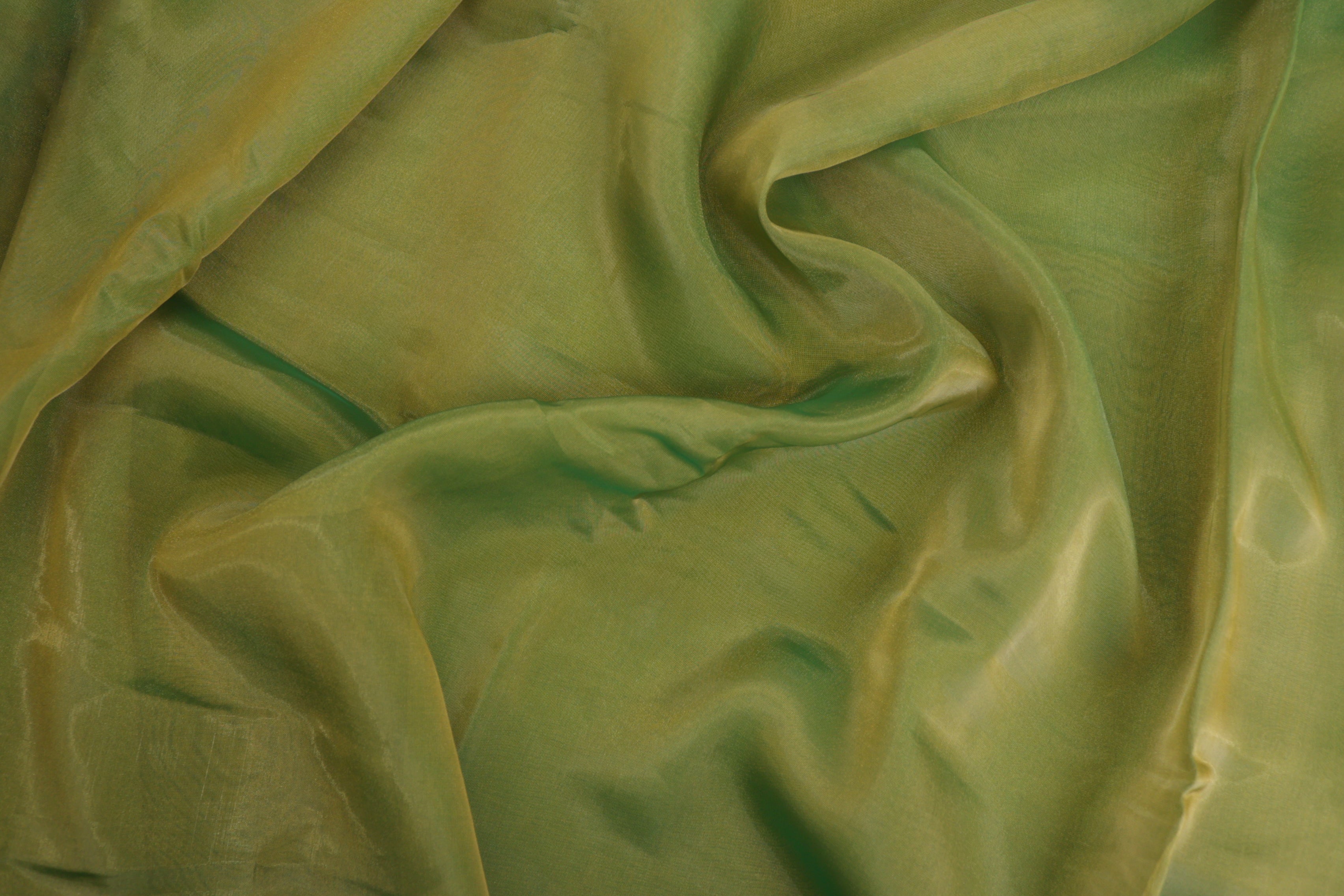 Pakistani green coloured Soft tissue tissue fabric with gold shimmer