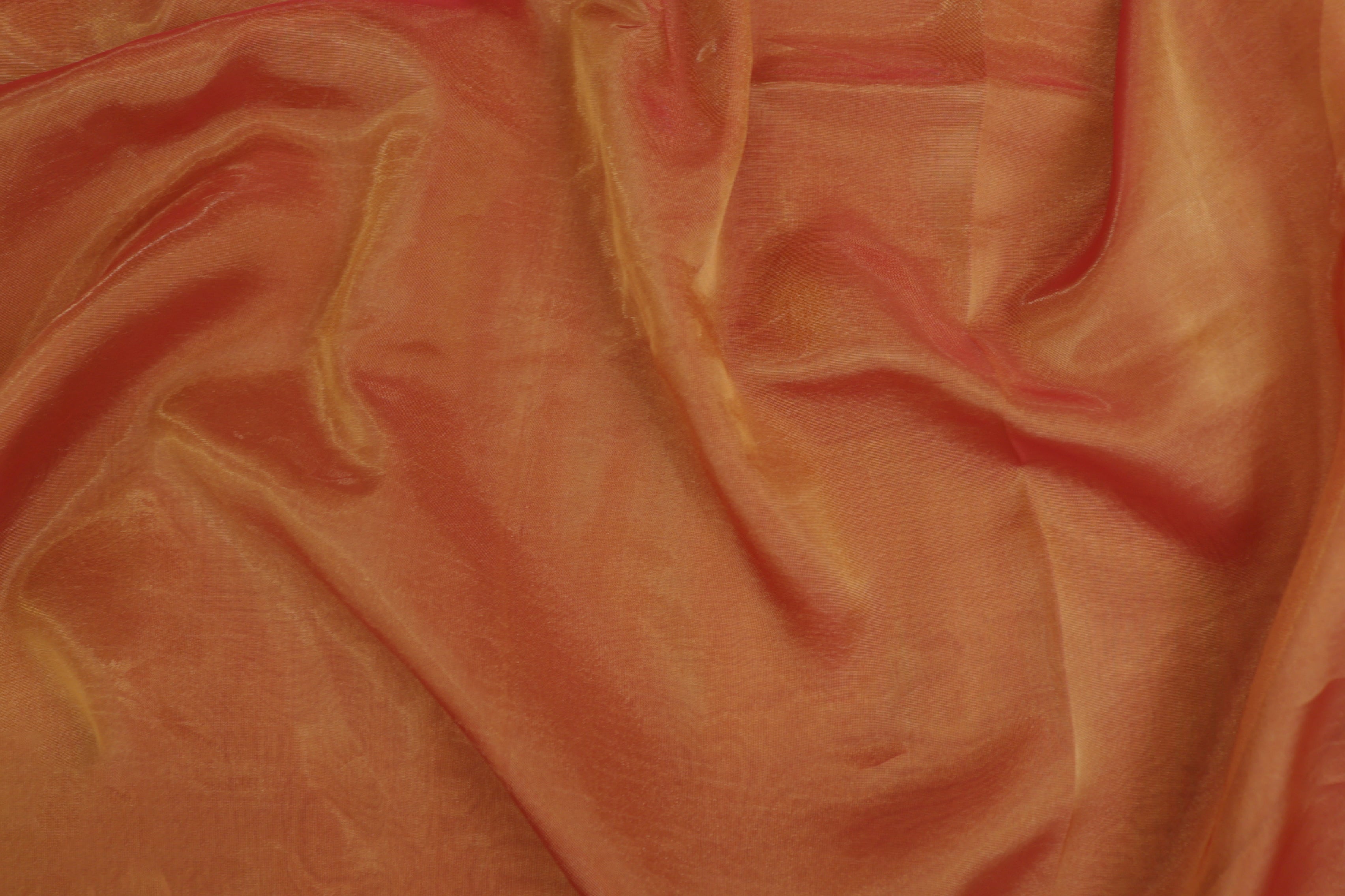 Rust orange coloured Soft tissue tissue fabric with gold shimmer