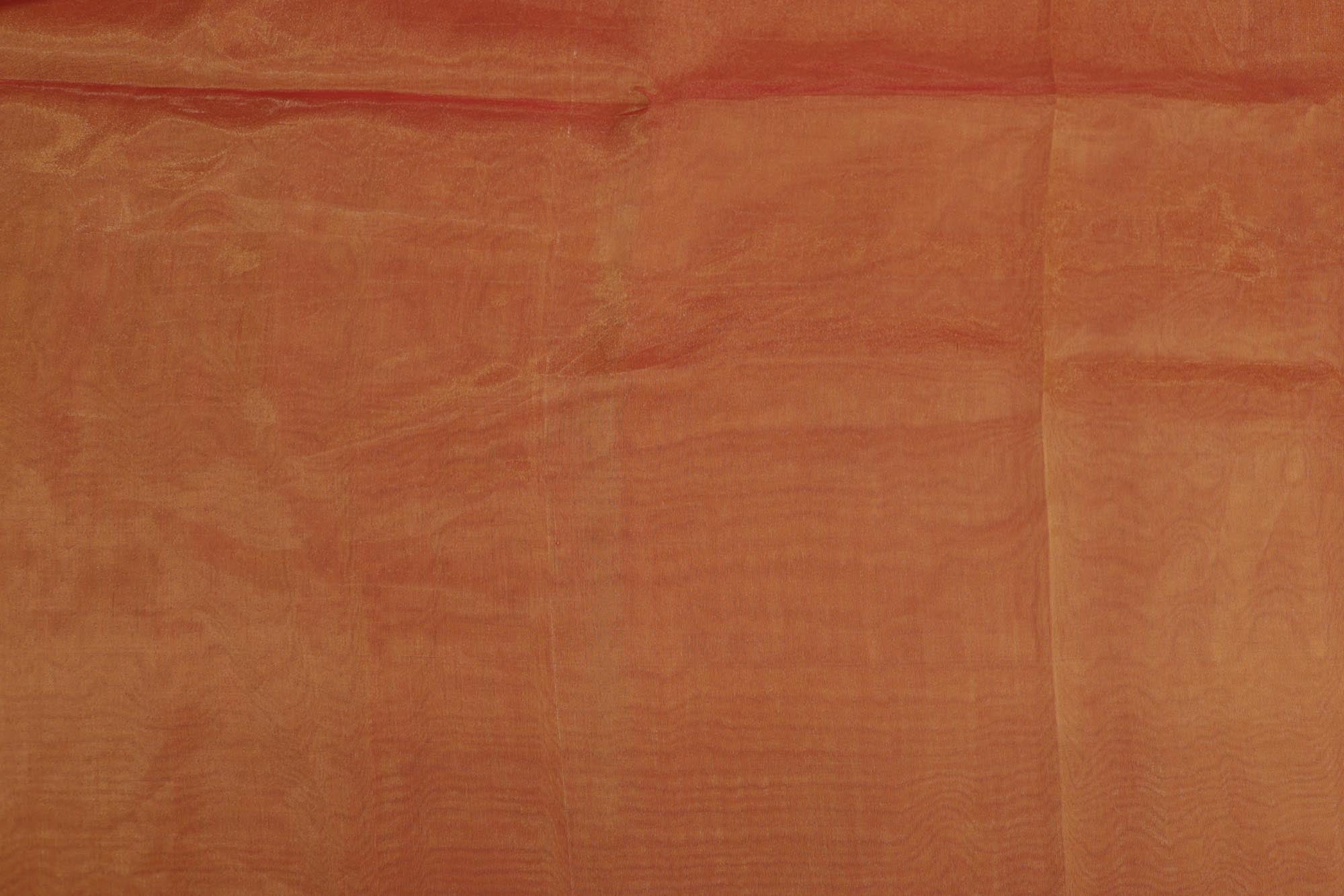 Rust orange coloured Soft tissue fabric with gold shimmer