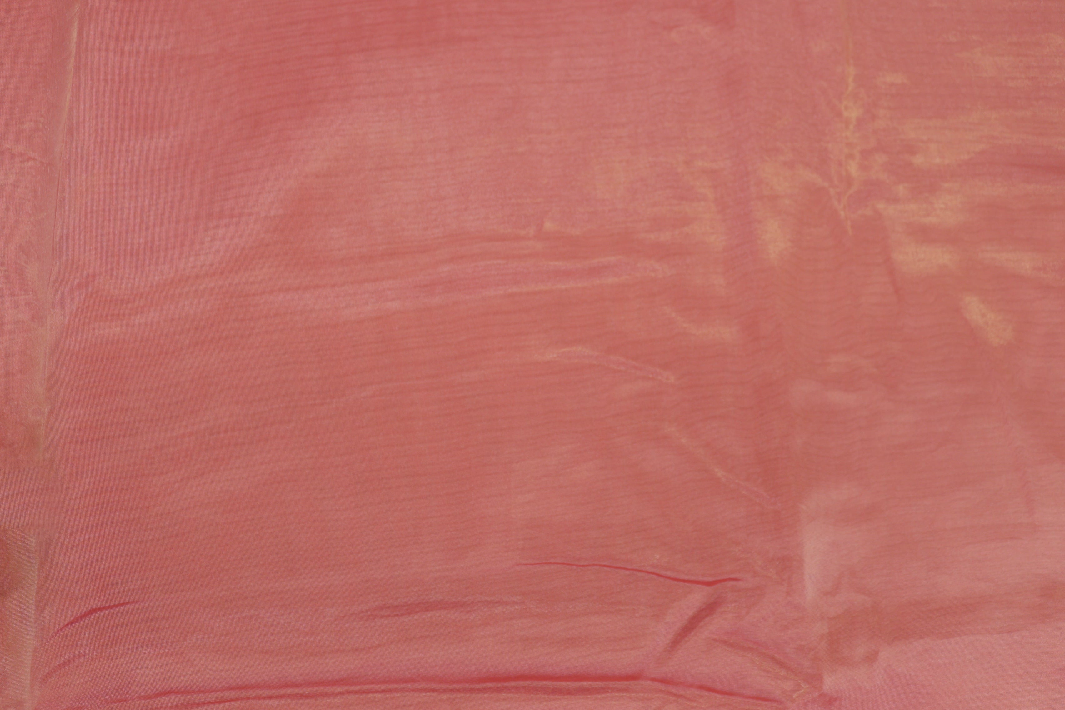 Gajri pink coloured Soft tissue tissue fabric with gold shimmer