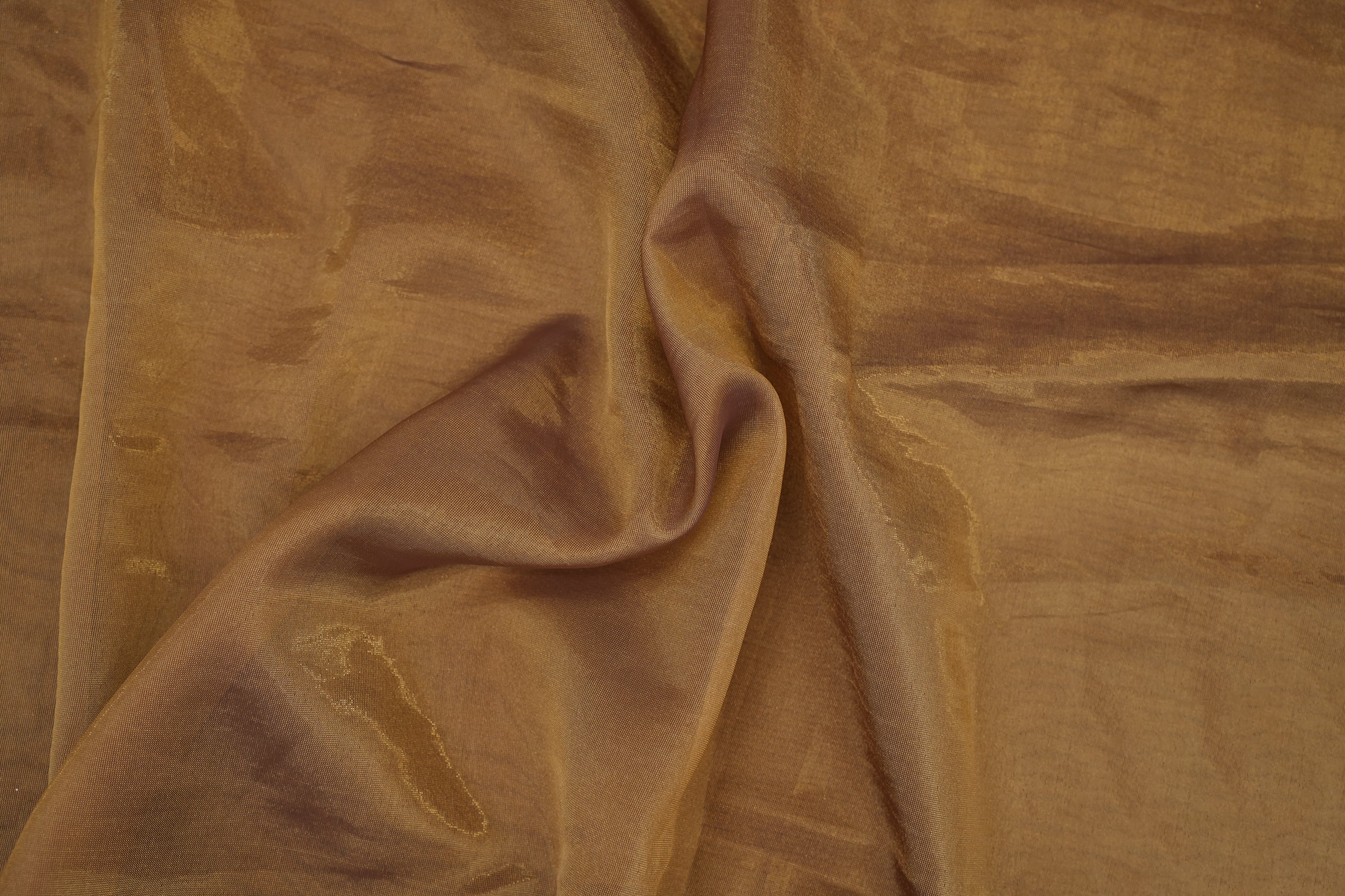 Copper coloured Soft tissue tissue fabric with gold shimmer