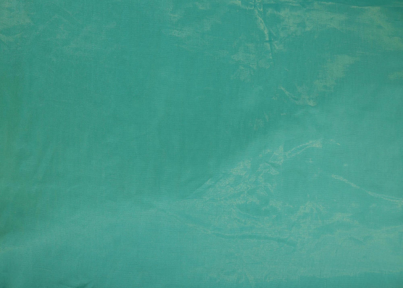 Light firozi coloured Soft tissue tissue fabric with gold shimmer