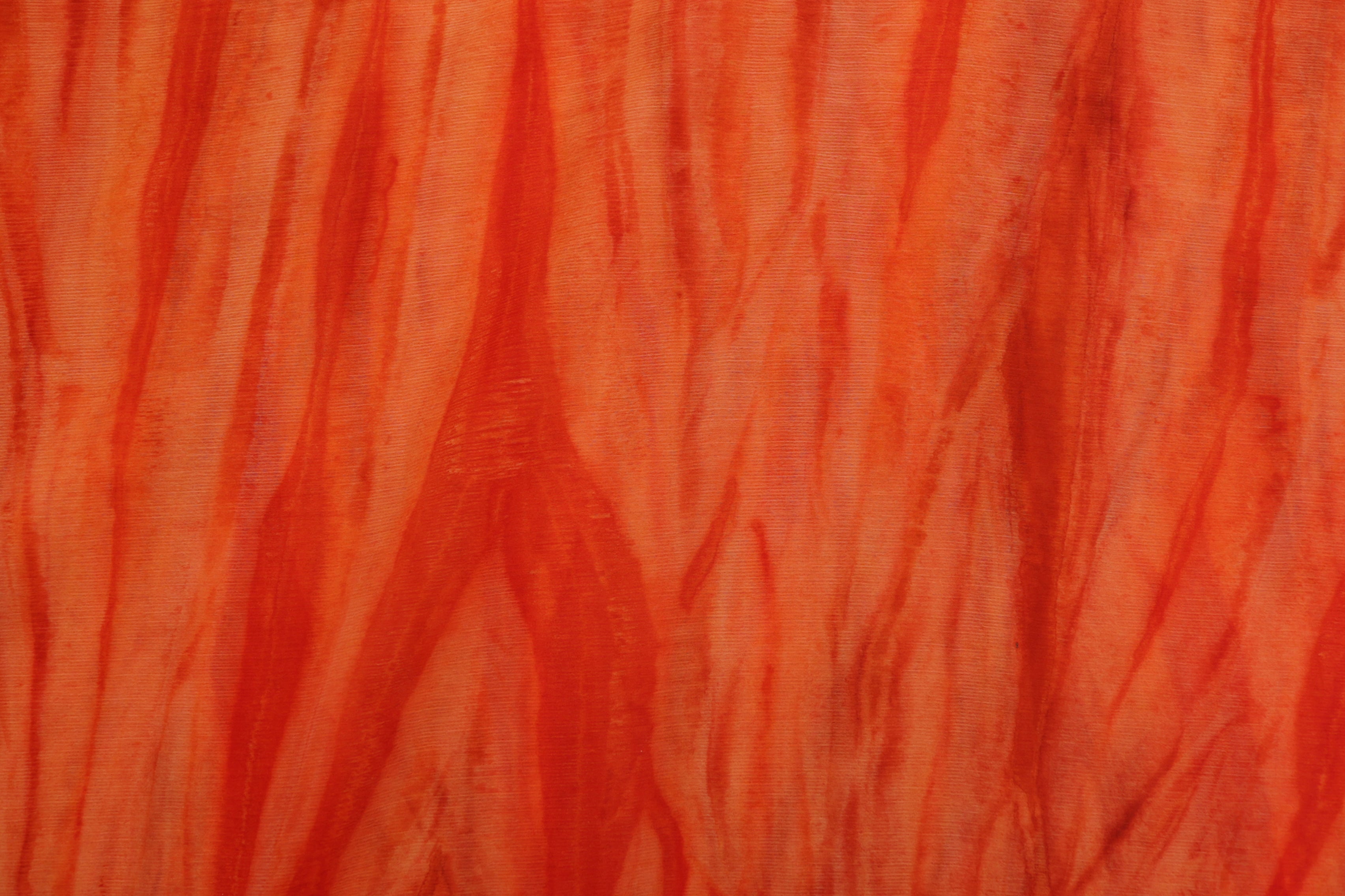 Burnt orange coloured textured chiffon fabric