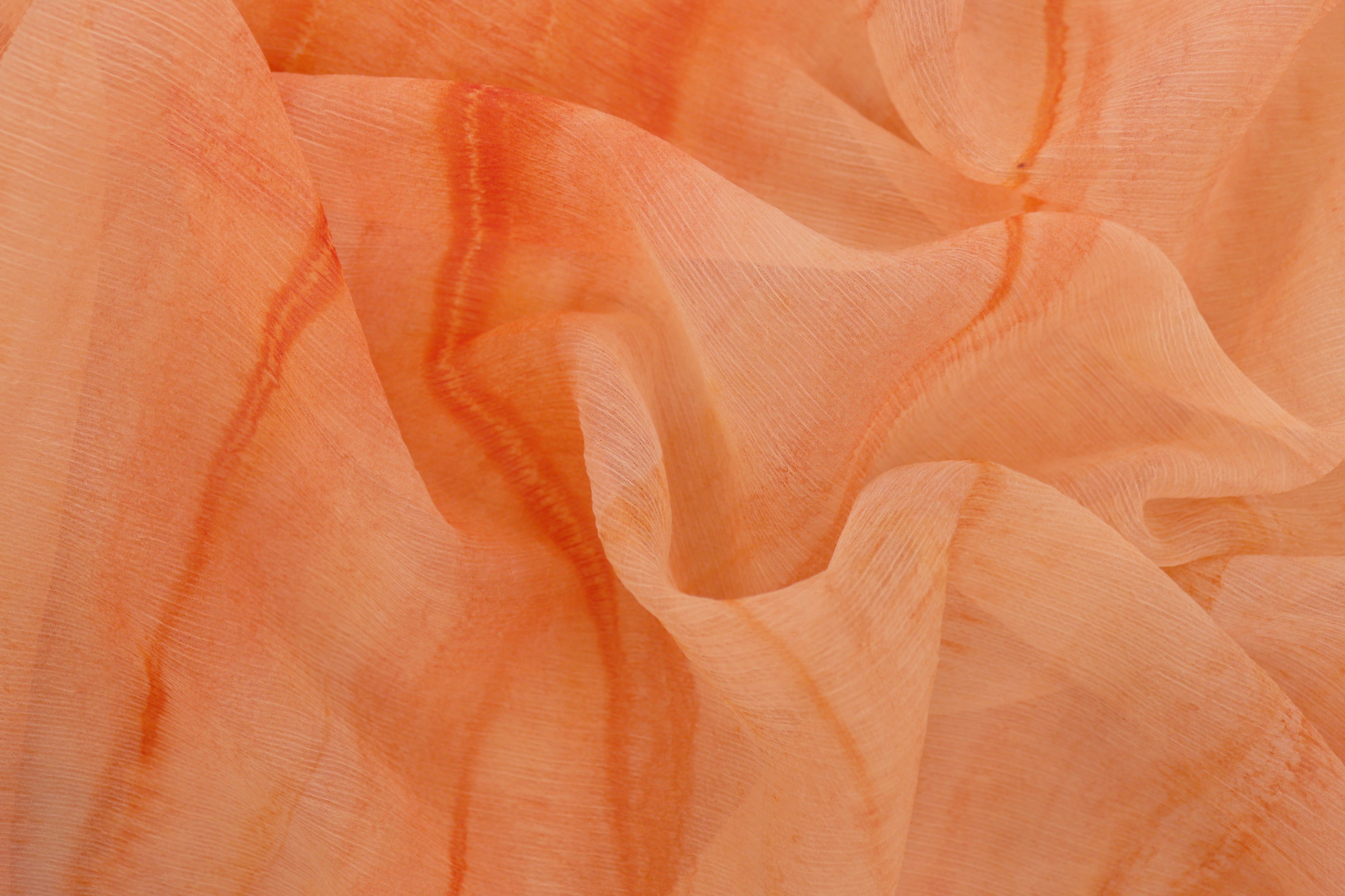 Light orange Coloured textured chiffon fabric