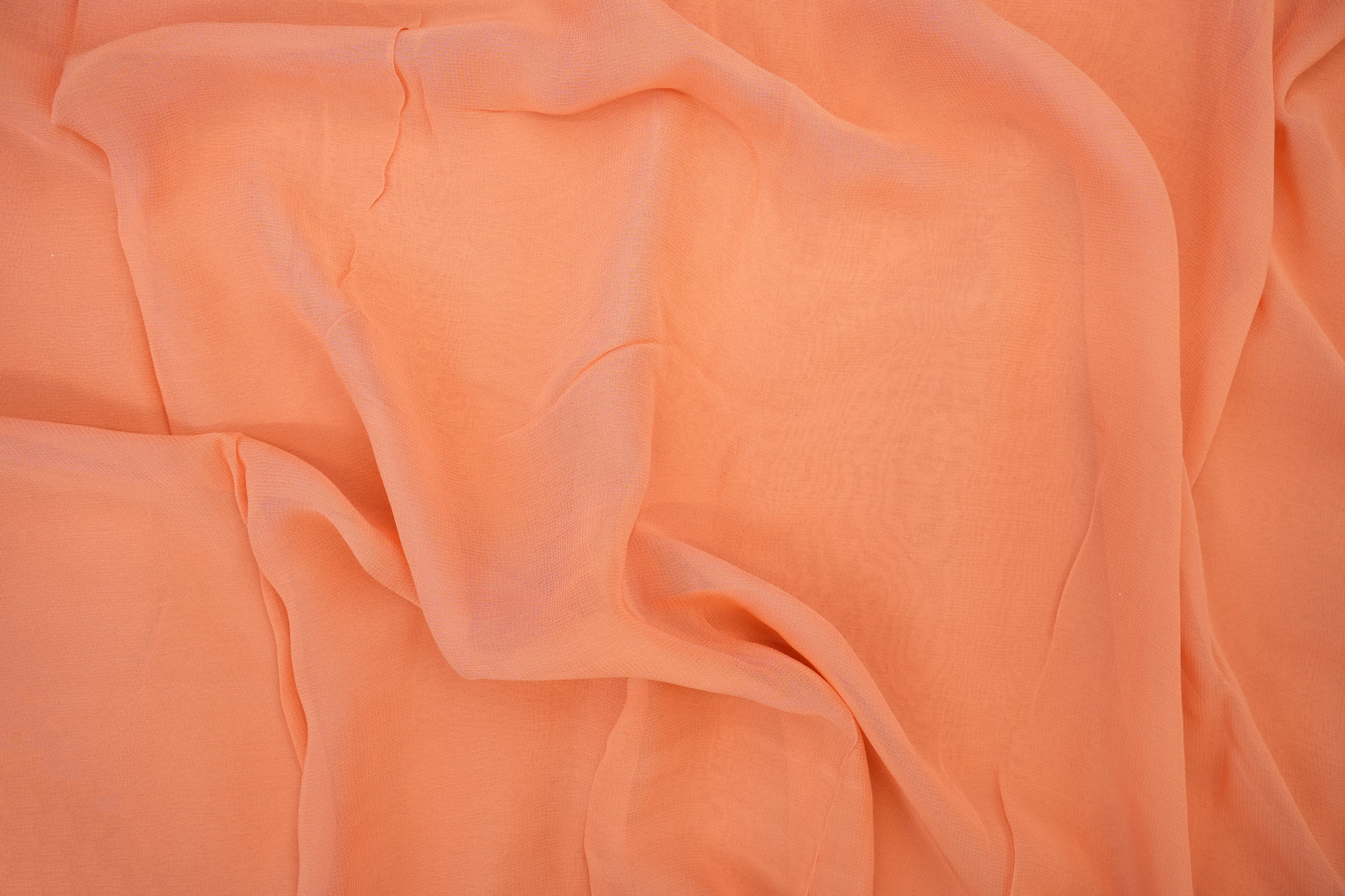 Peach plain georgette fabric