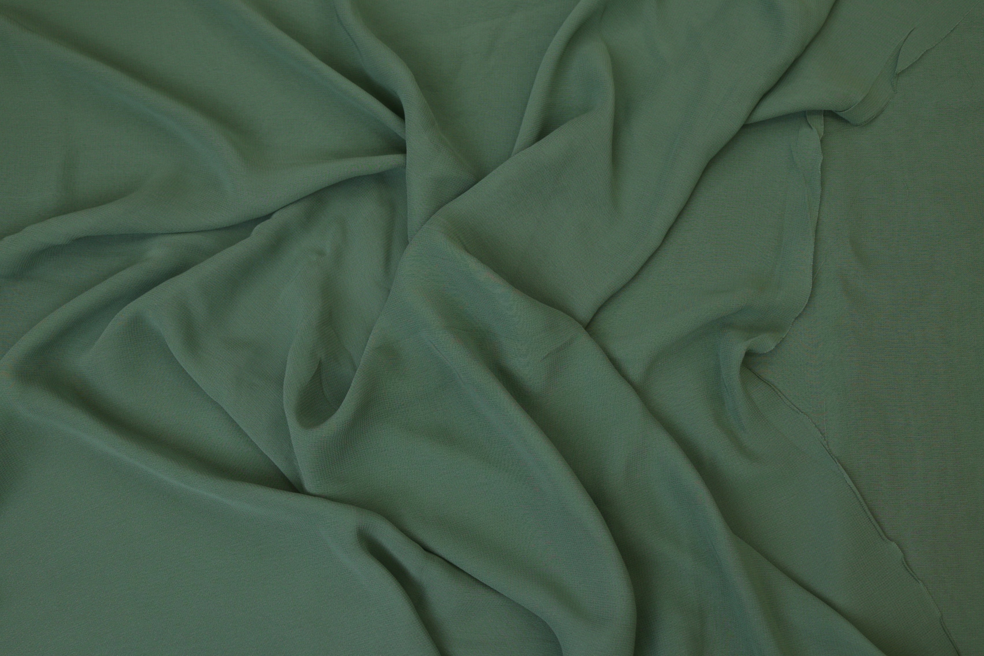 Greyish green plain georgette fabric