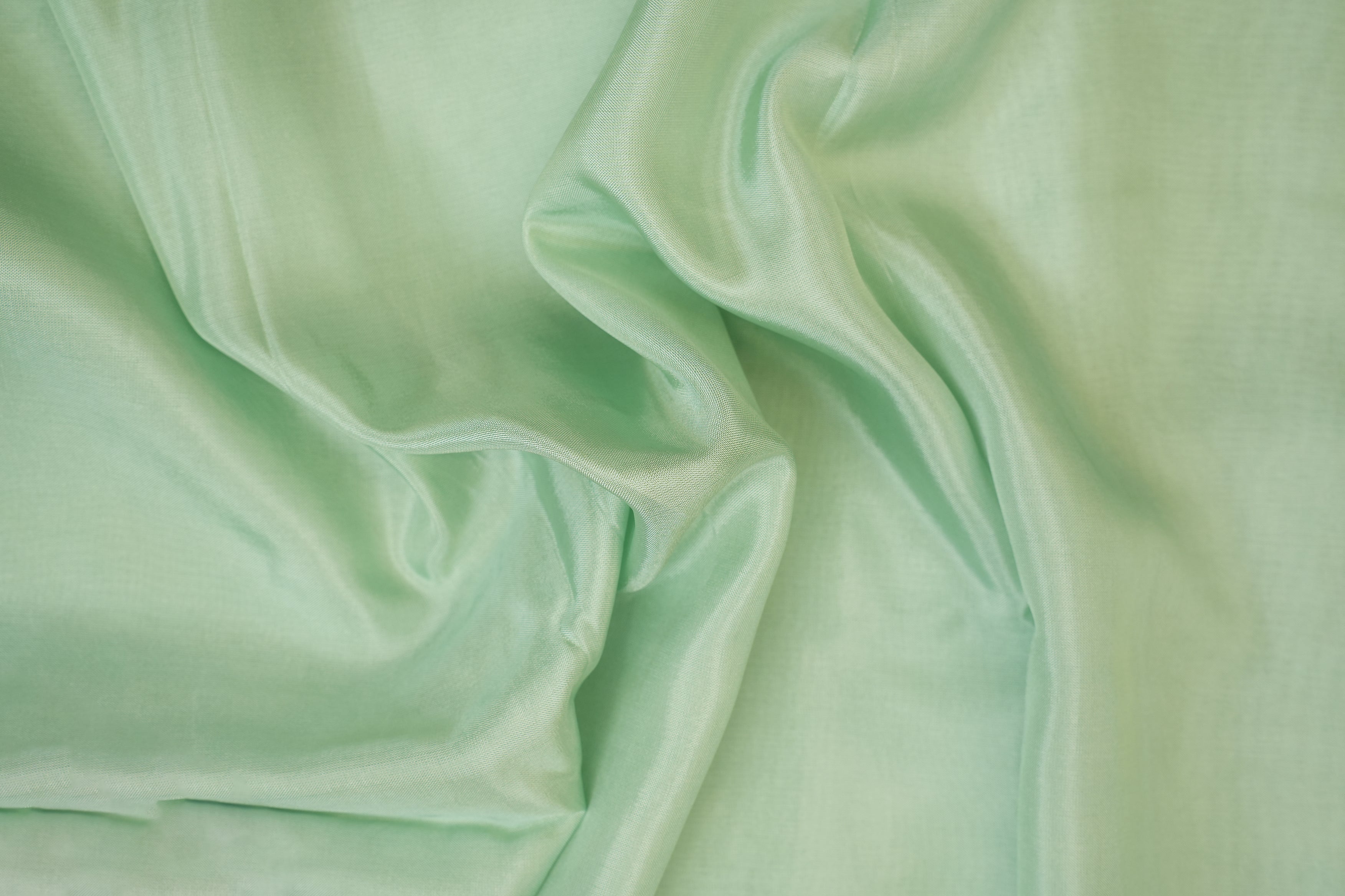 Pista green coloured upada silk fabric