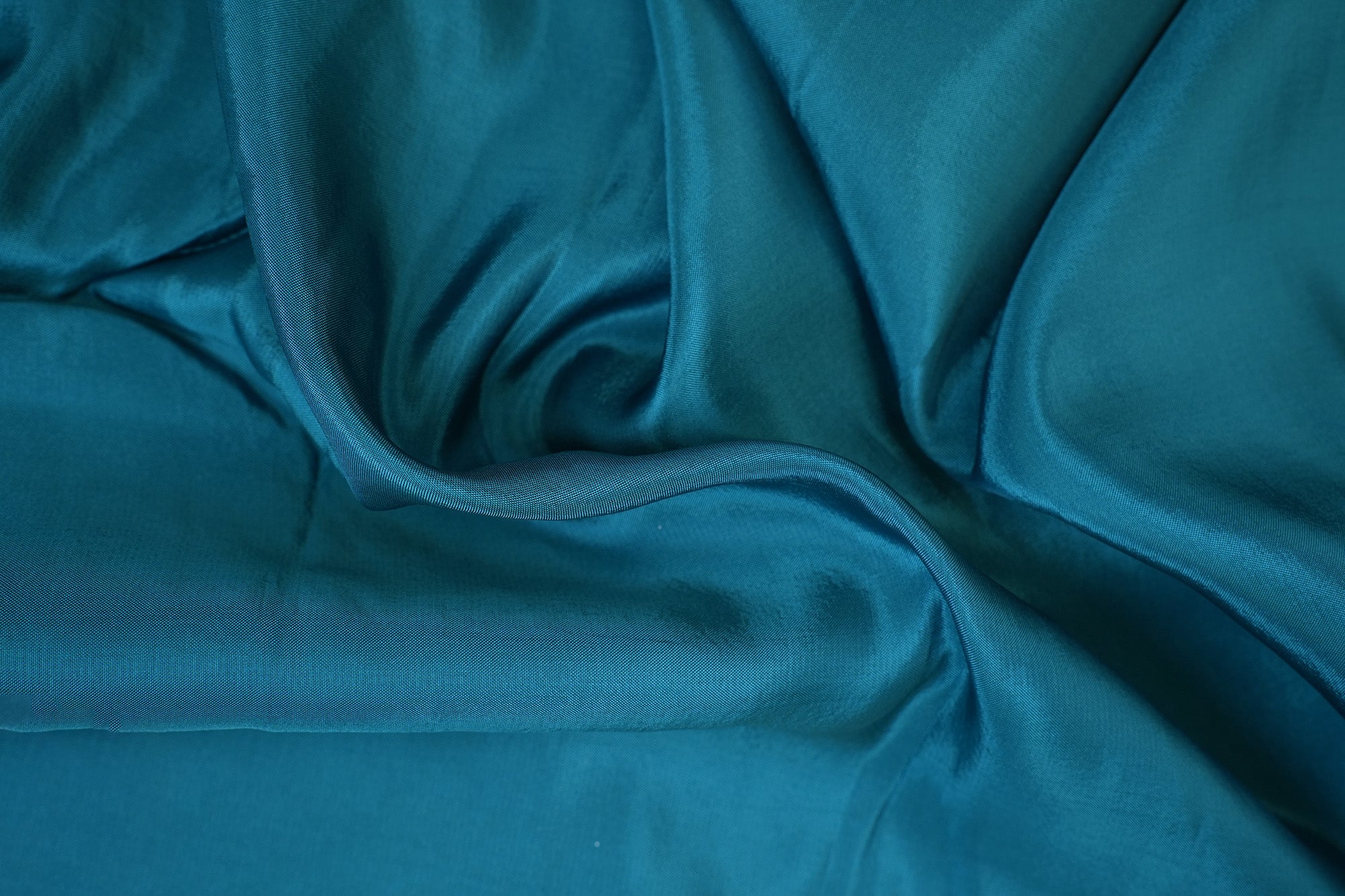 Teal blue coloured upada silk fabric