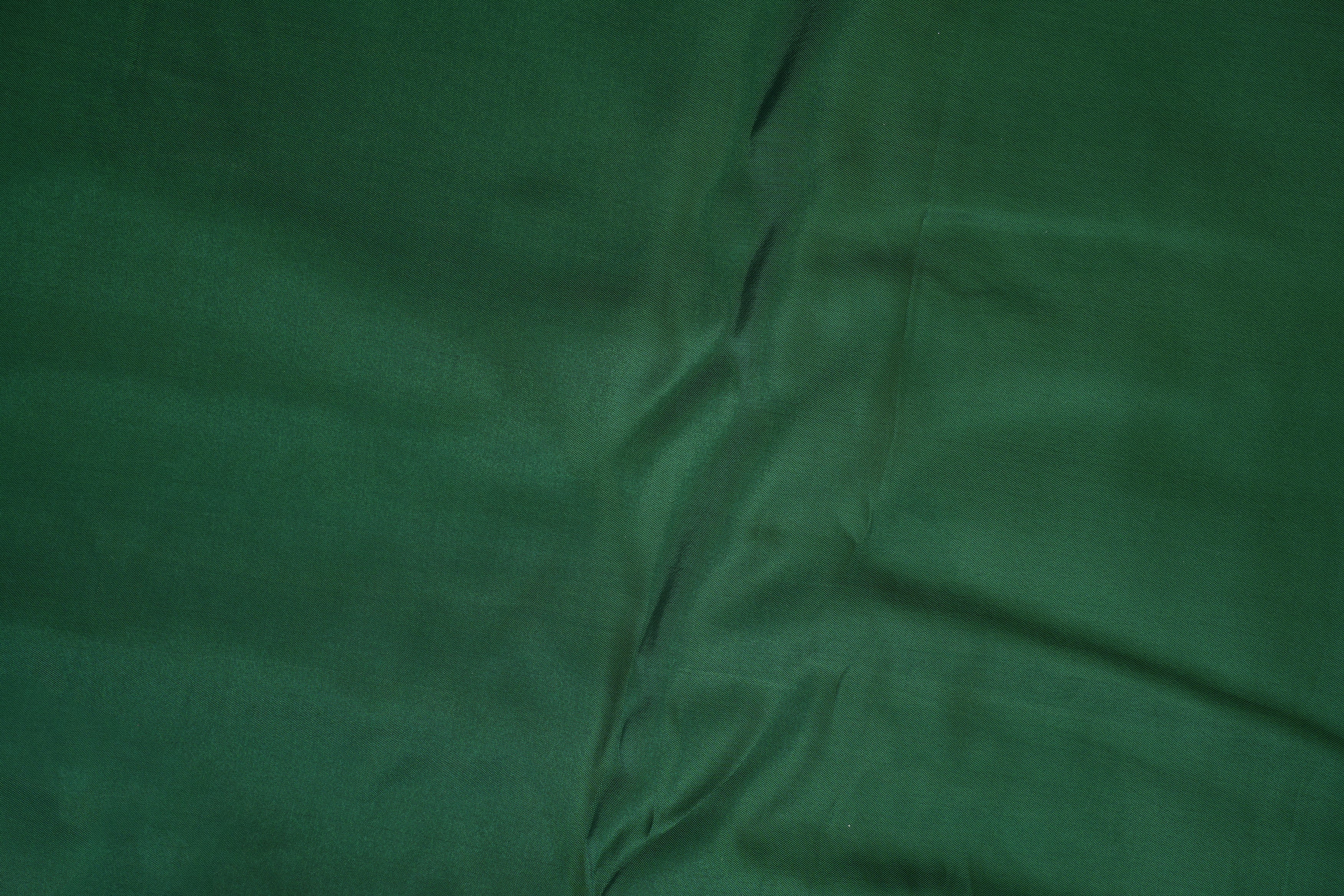 Dark green coloured upada silk fabric