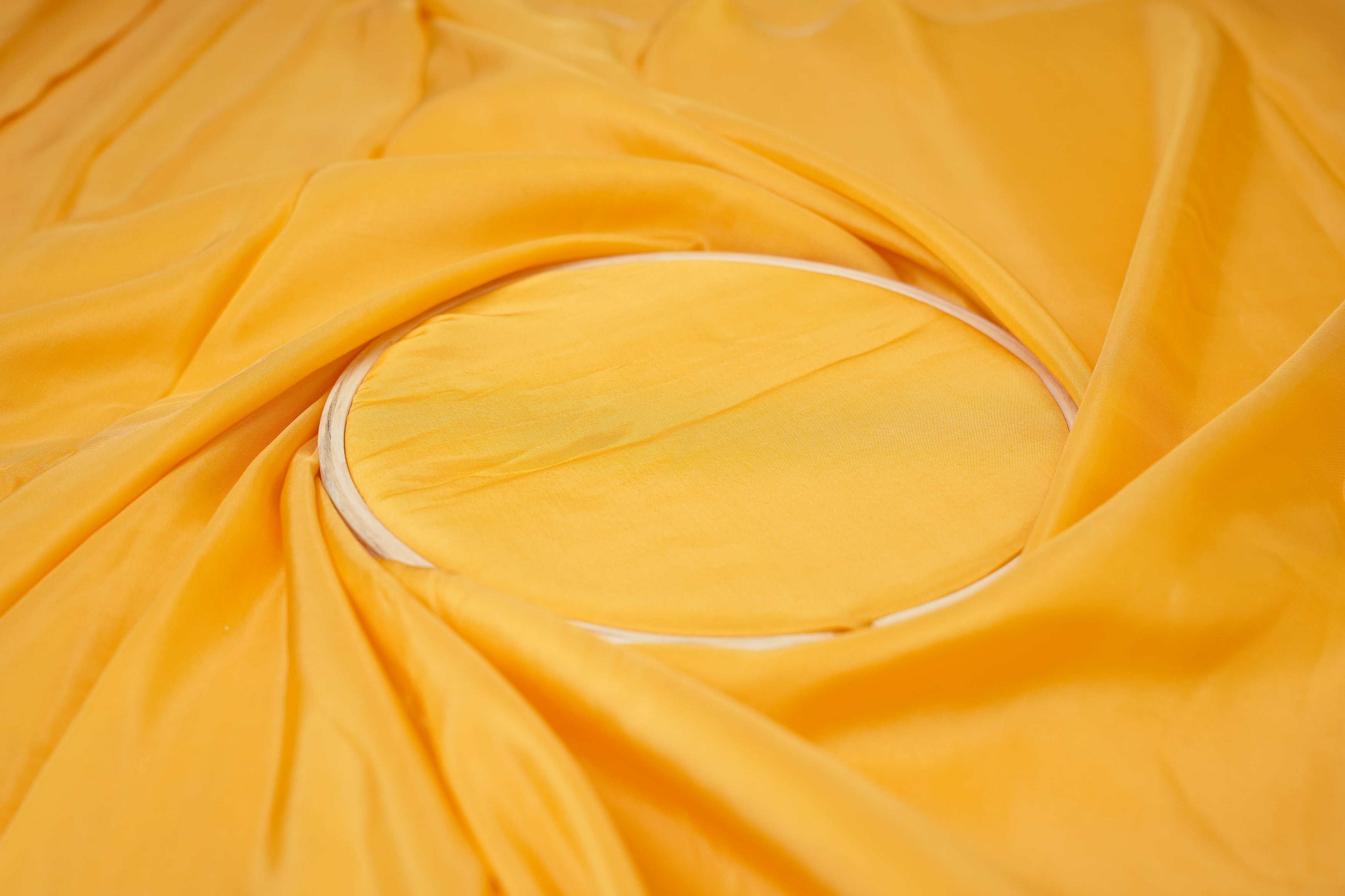 Bright yellow coloured upada silk fabric