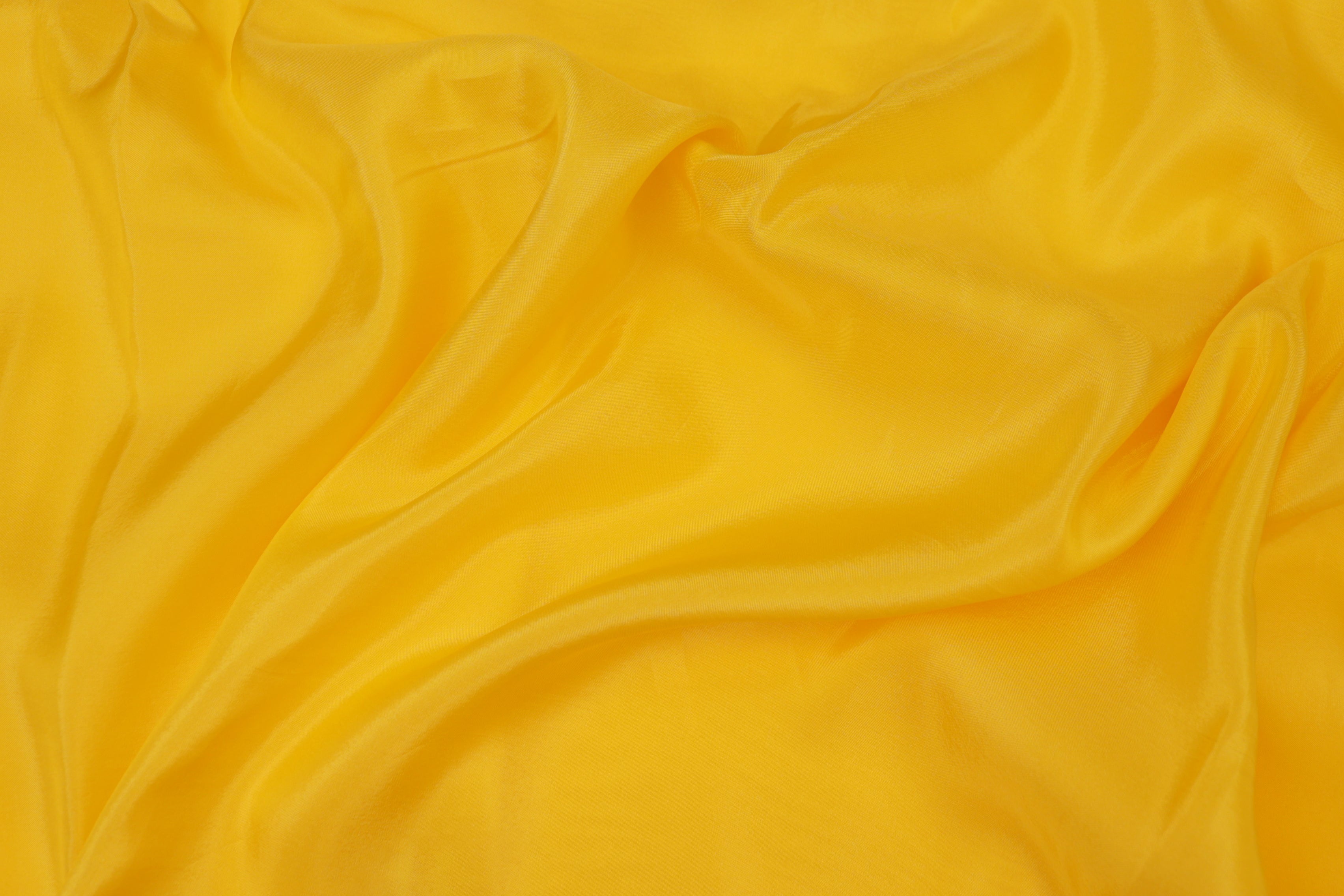 Bright yellow  coloured upada silk fabric