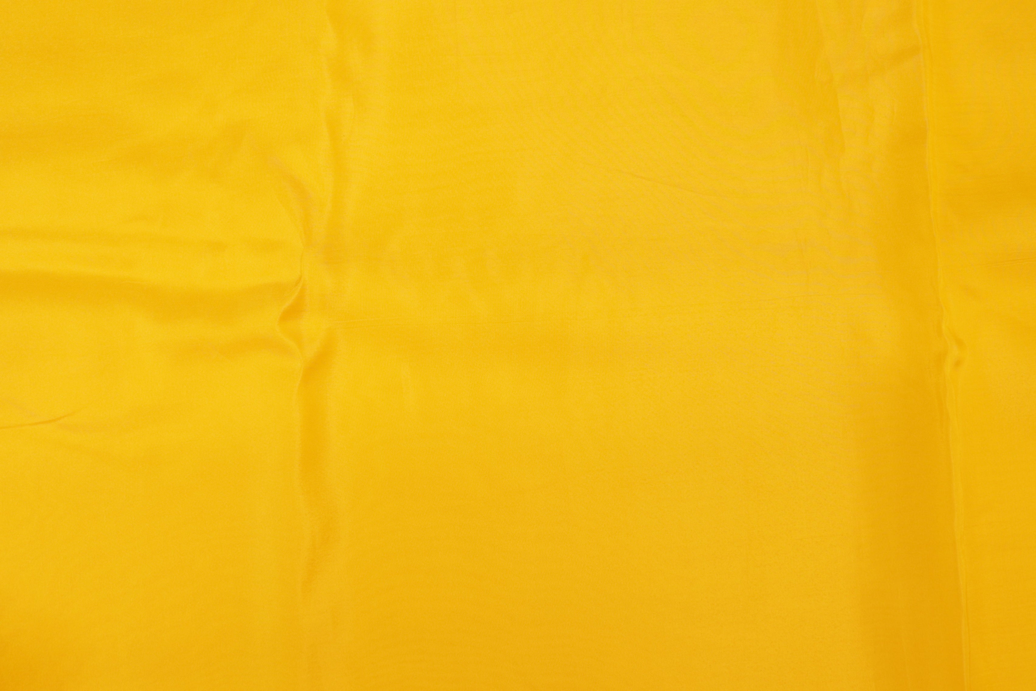 Bright yellow  coloured upada silk fabric