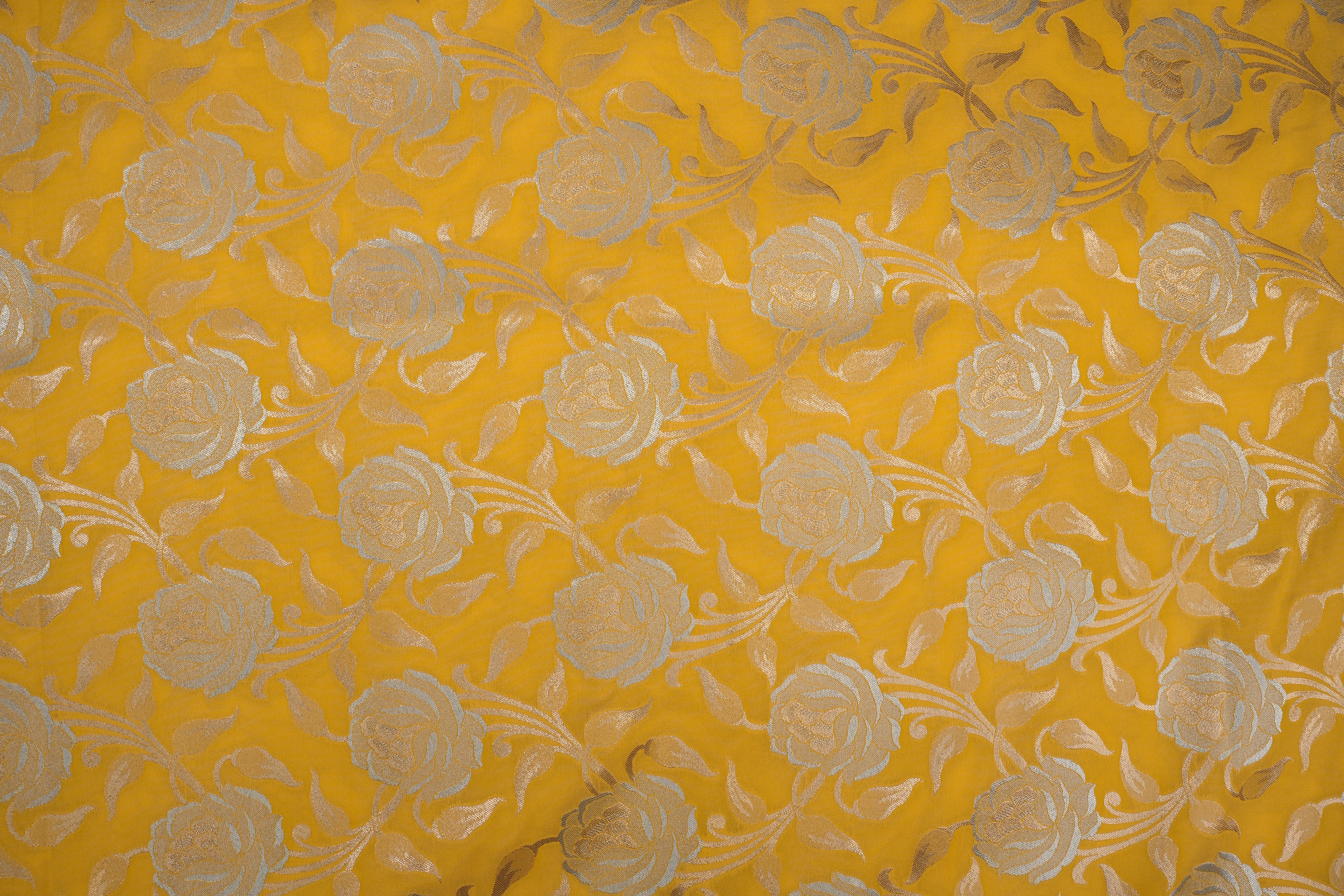 Yellow colour banarasi brocade fabric with beautiful floral pattern