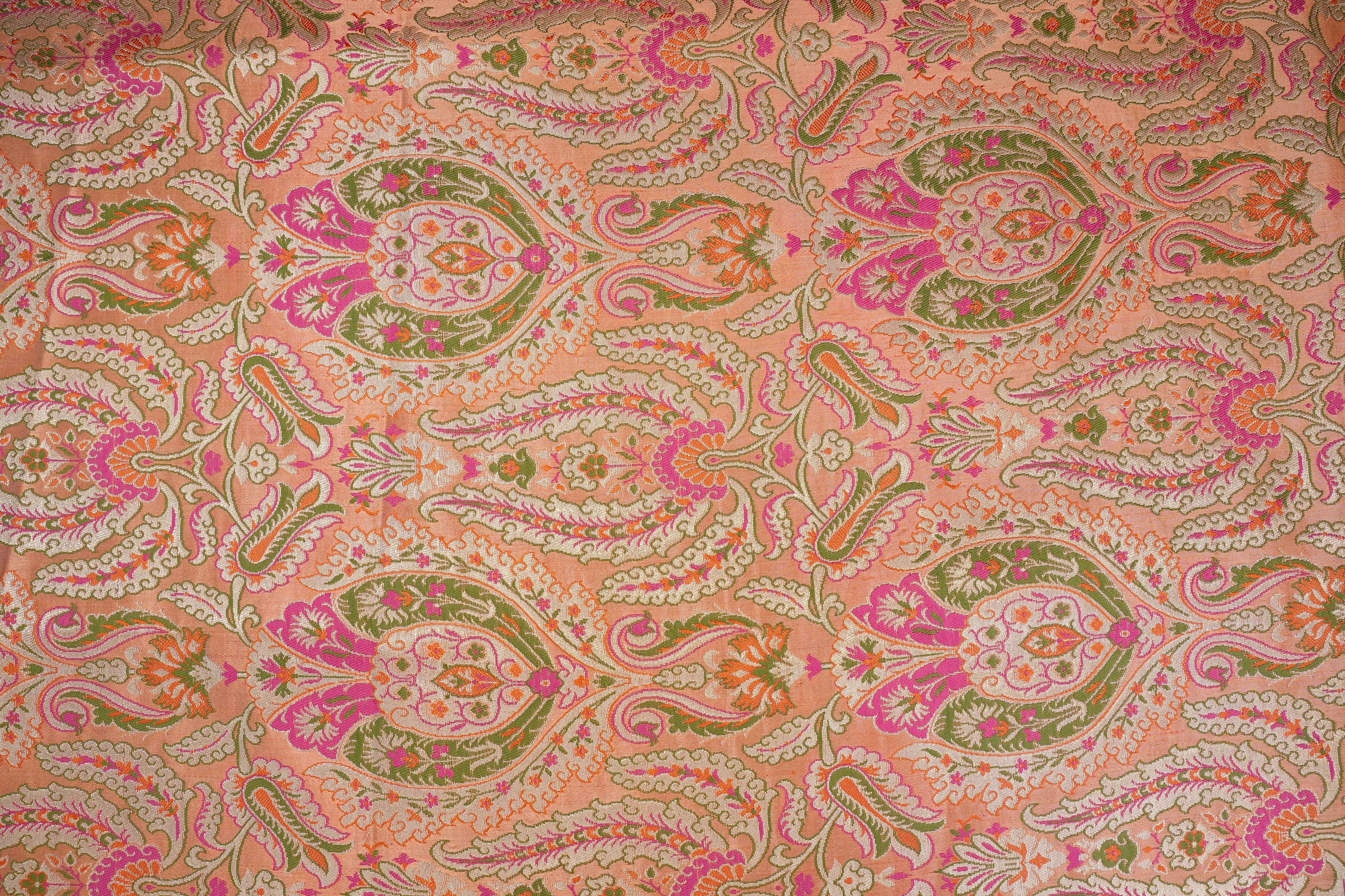 Peach colour banarasi brocade fabric with beautiful Traditional pattern