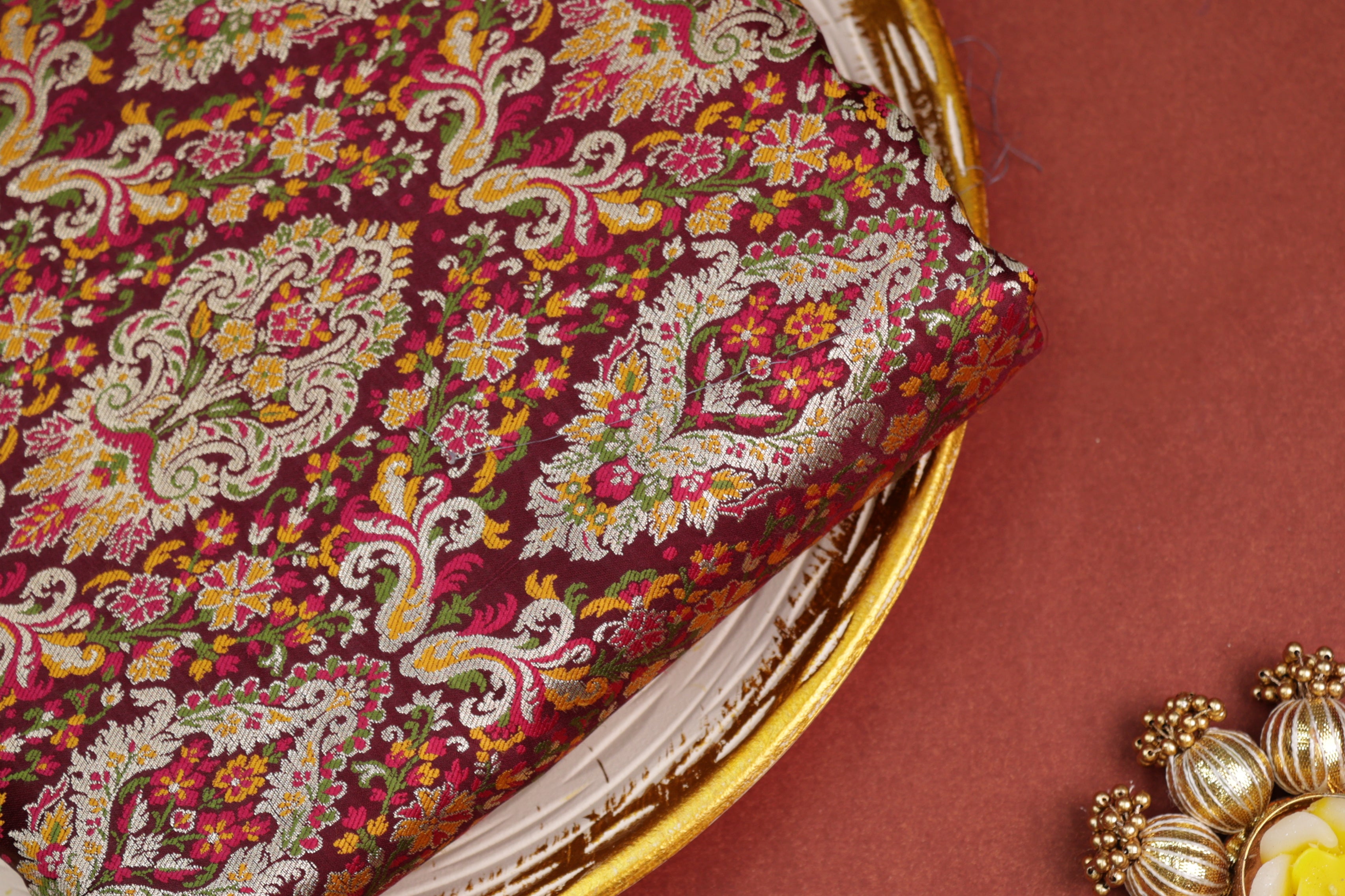 Maroon colour banarasi brocade fabric with beautiful floral pattern