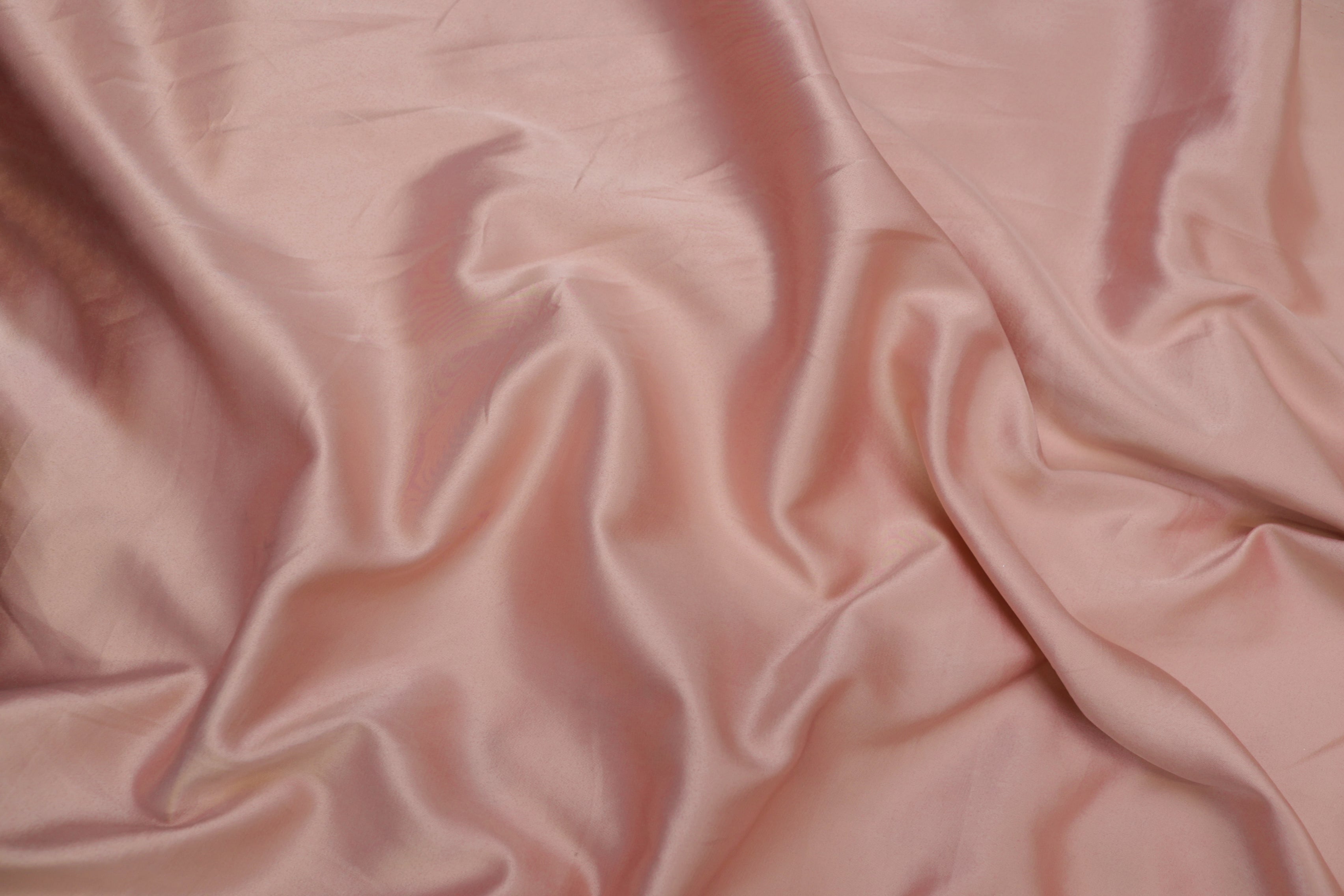 Peach pink colored royal satin