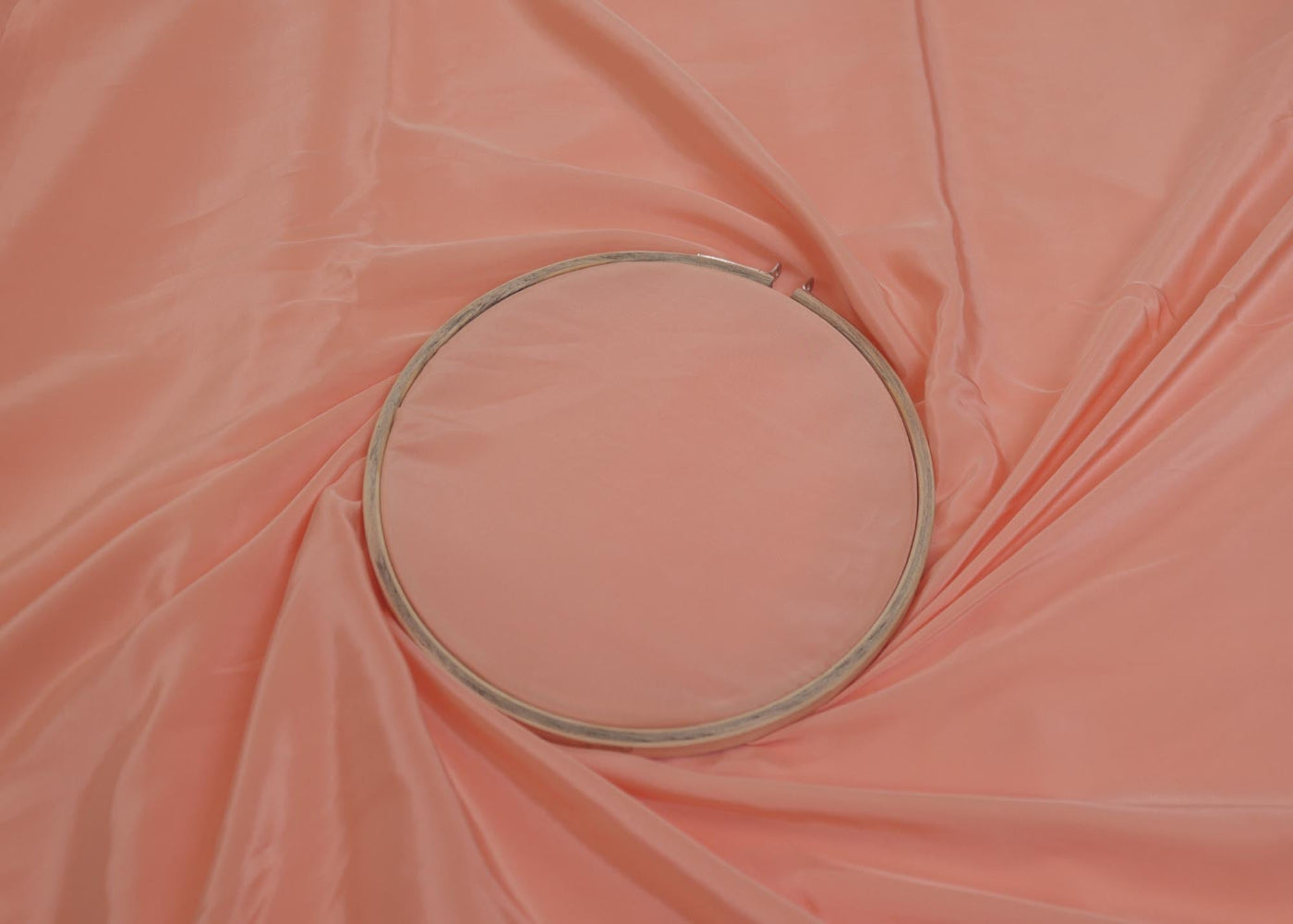 Coral coloured crepe fabric