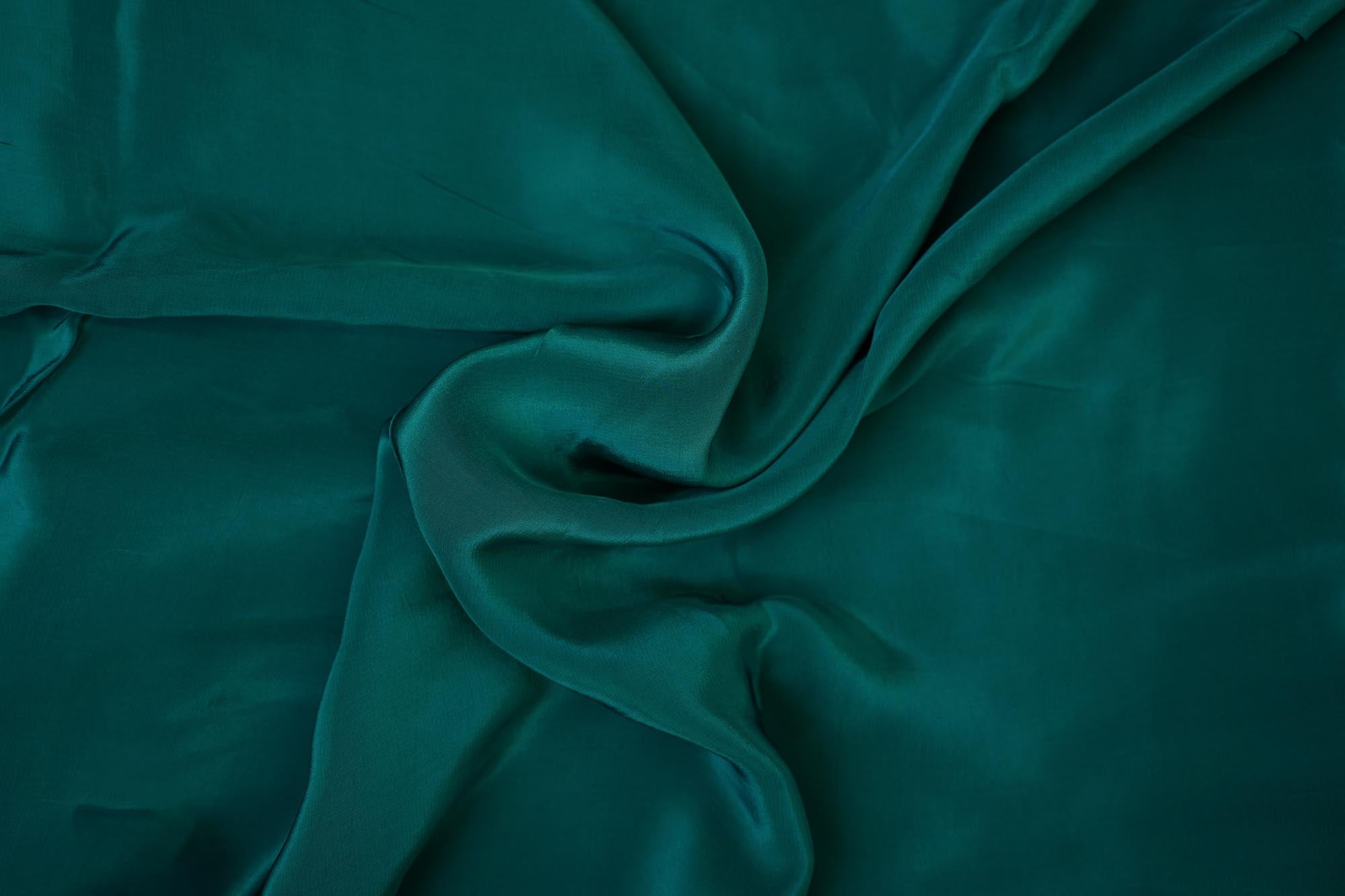 Rama green coloured crepe fabric