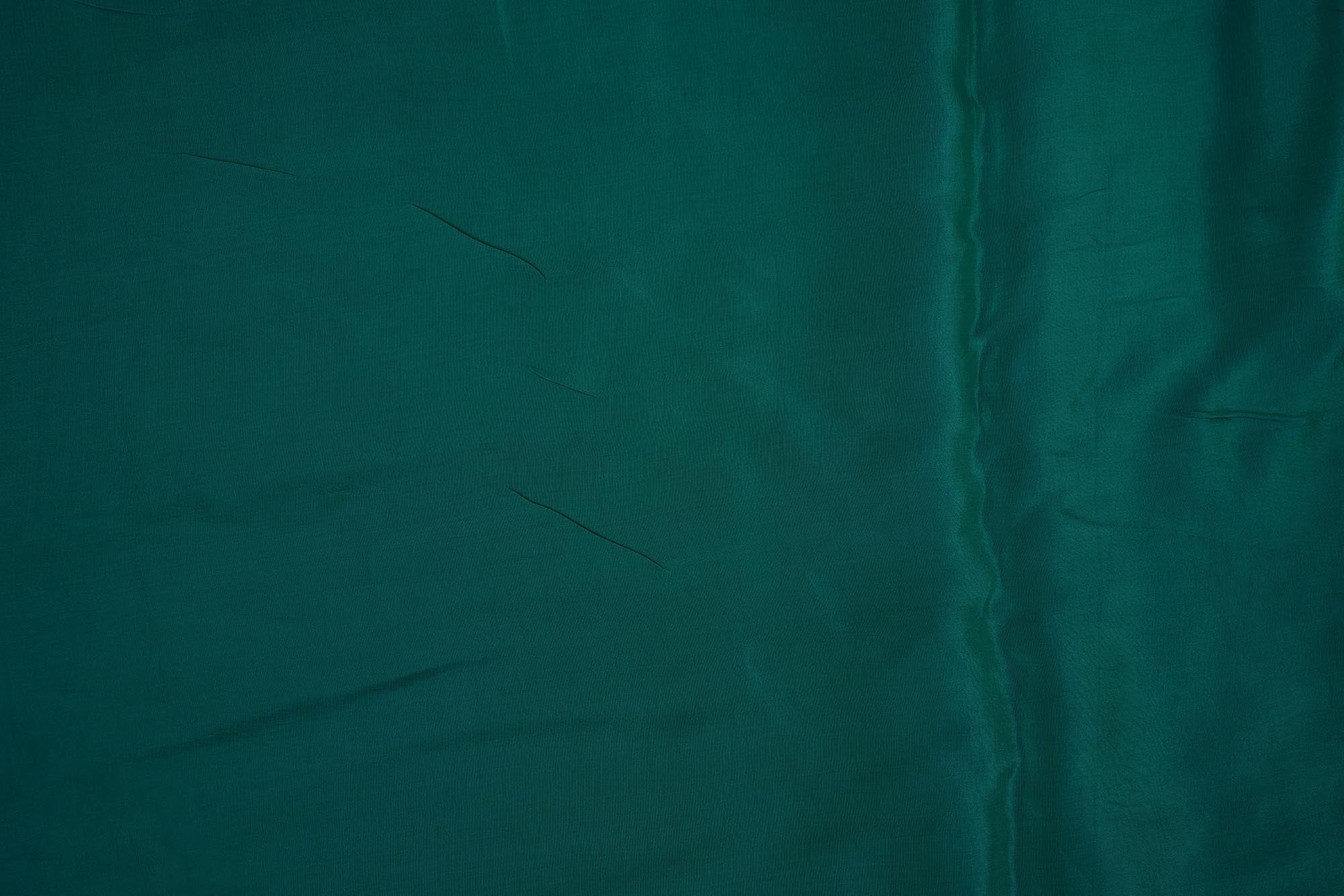 Rama green coloured crepe fabric