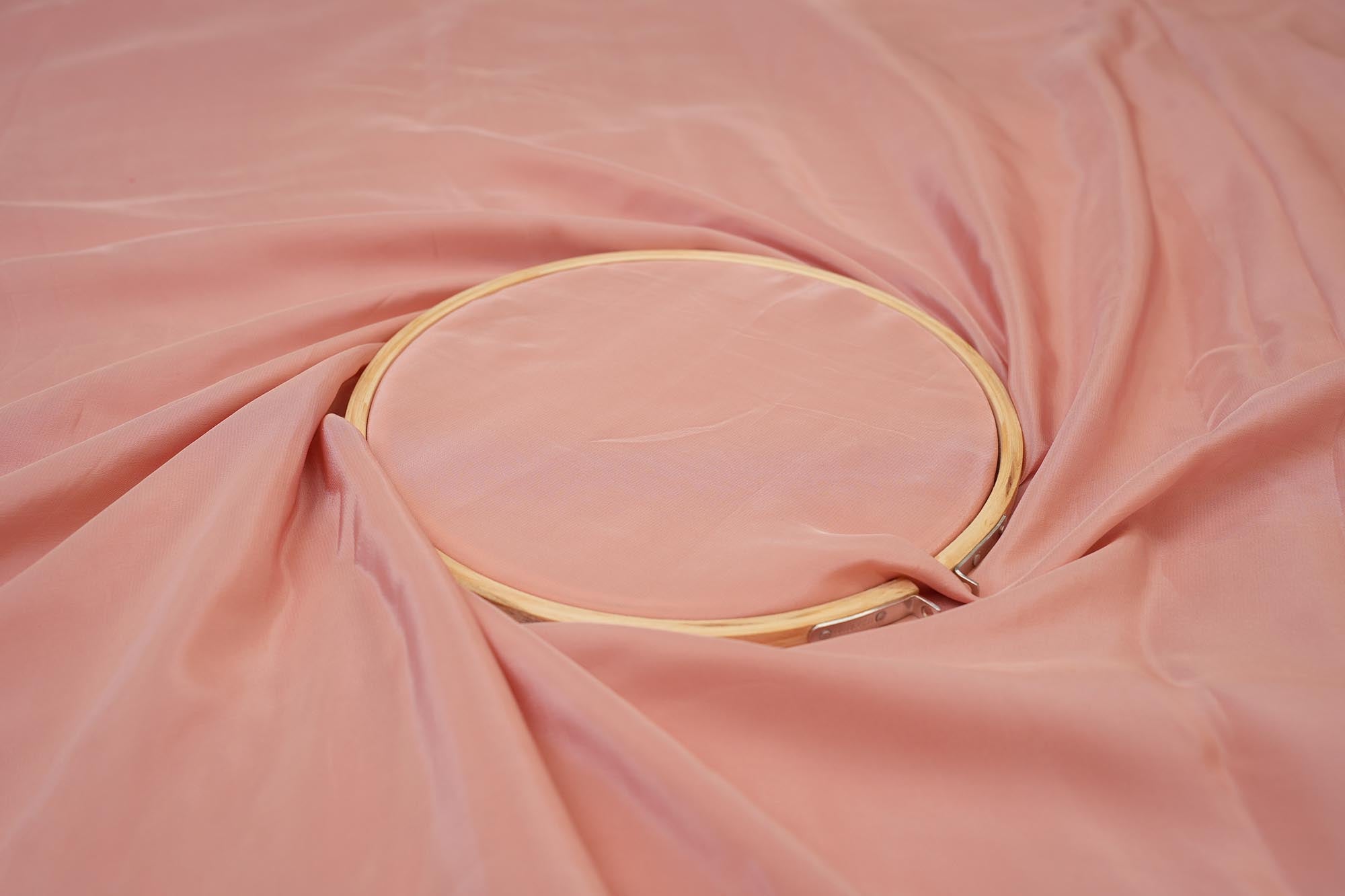 Dusky pink coloured crepe fabric