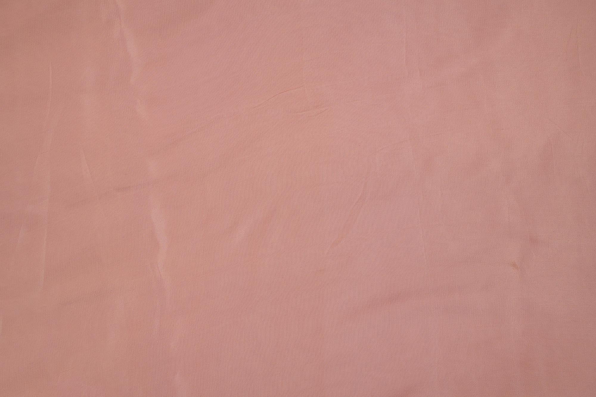 Dusky pink coloured crepe fabric