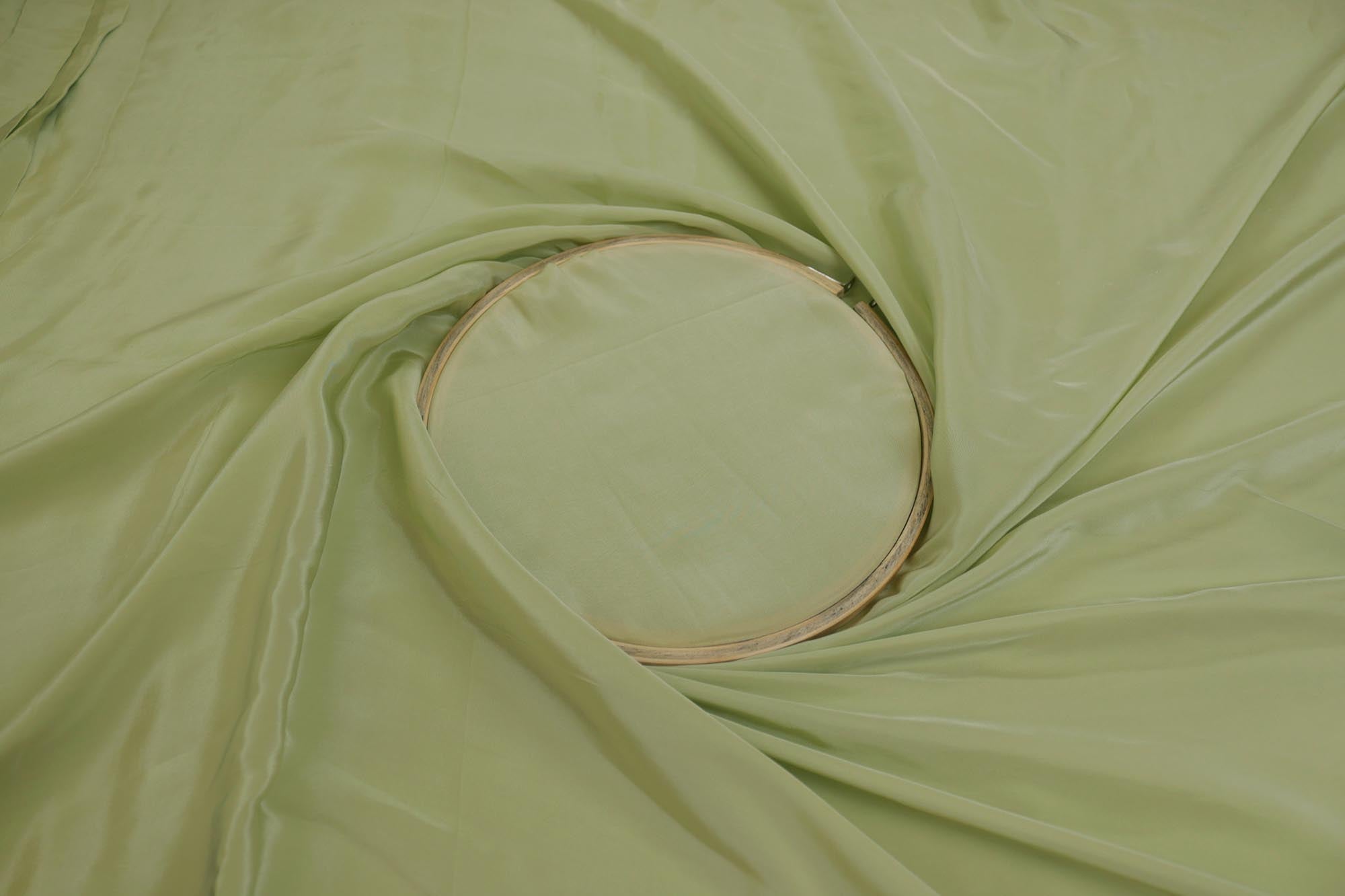 Pista green coloured crepe fabric