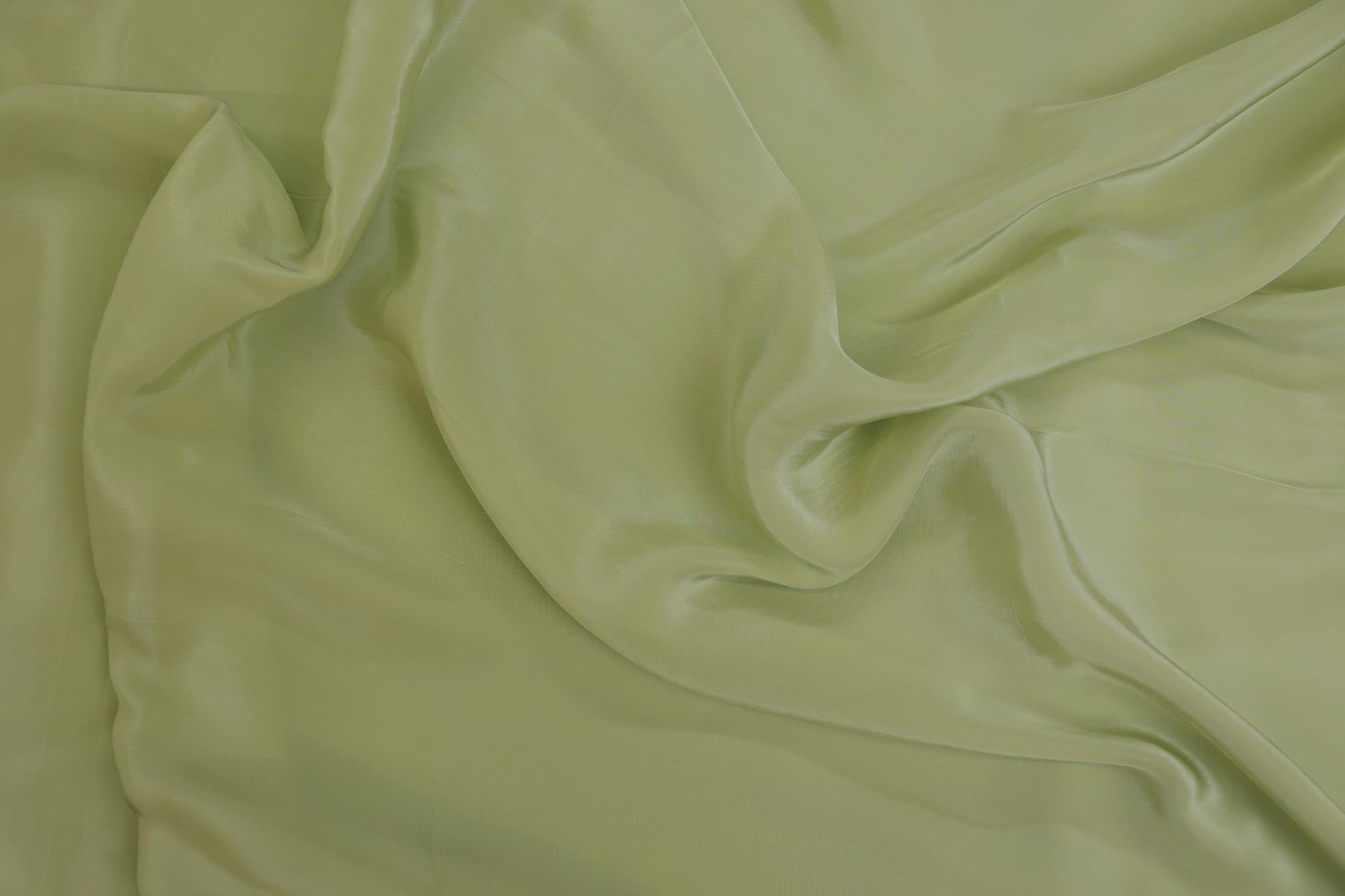 Pista green coloured crepe fabric