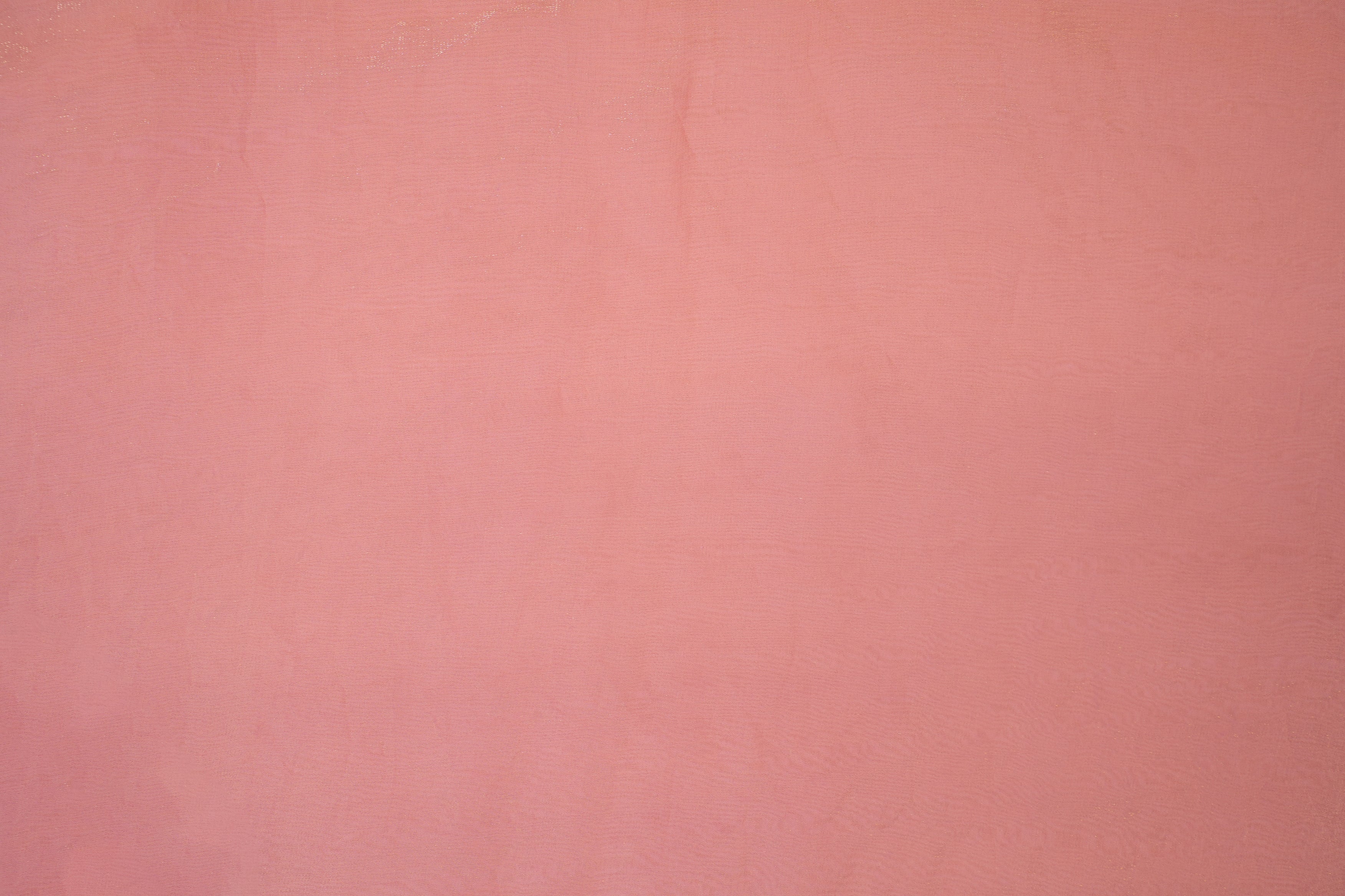 Peach pink coloured diamond tissue fabric