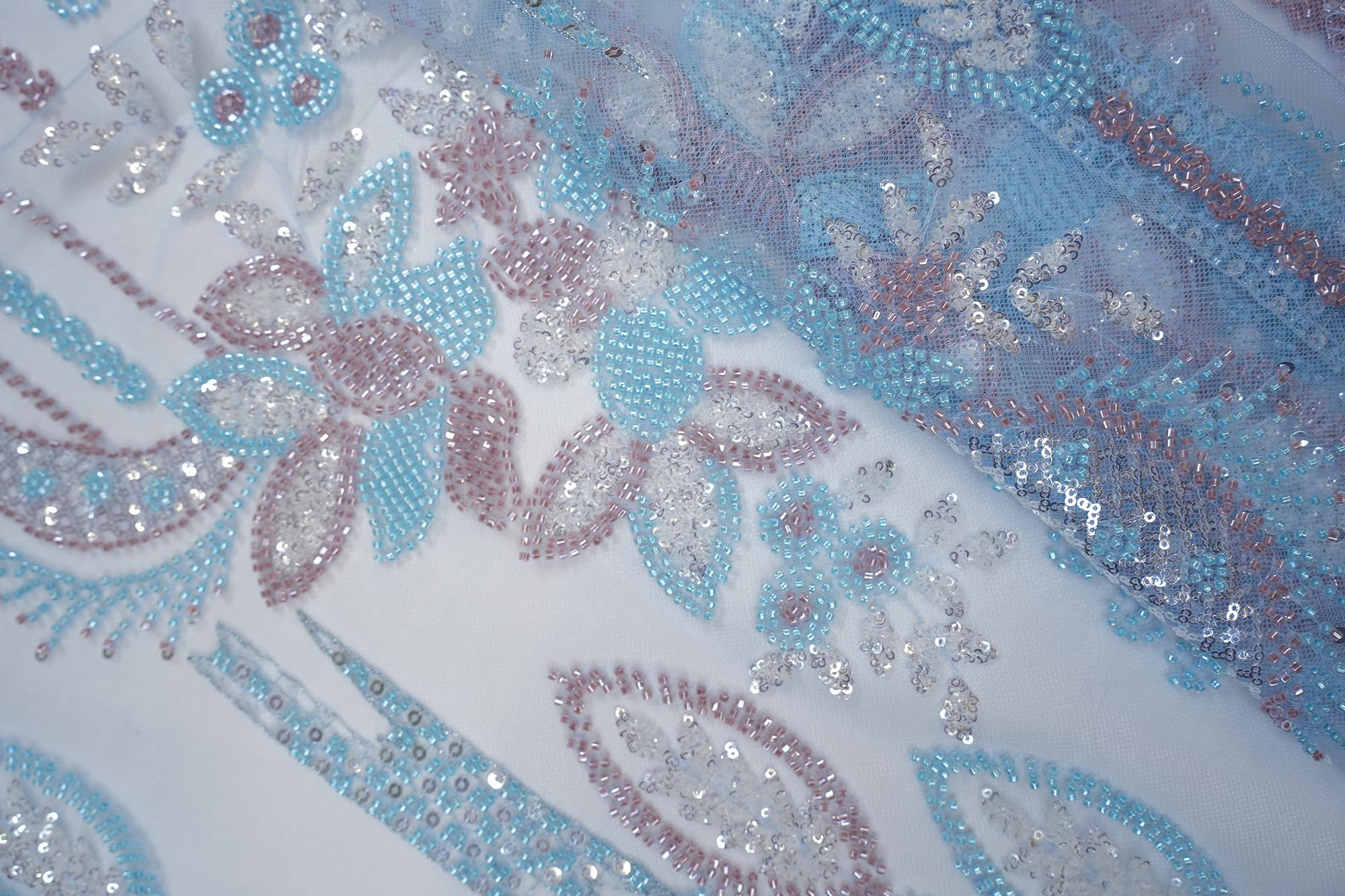 Light blue abstract pattern net with bead and pearl work